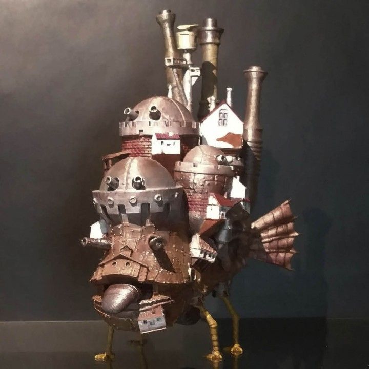 A metal bird with a house on it
Description automatically generated