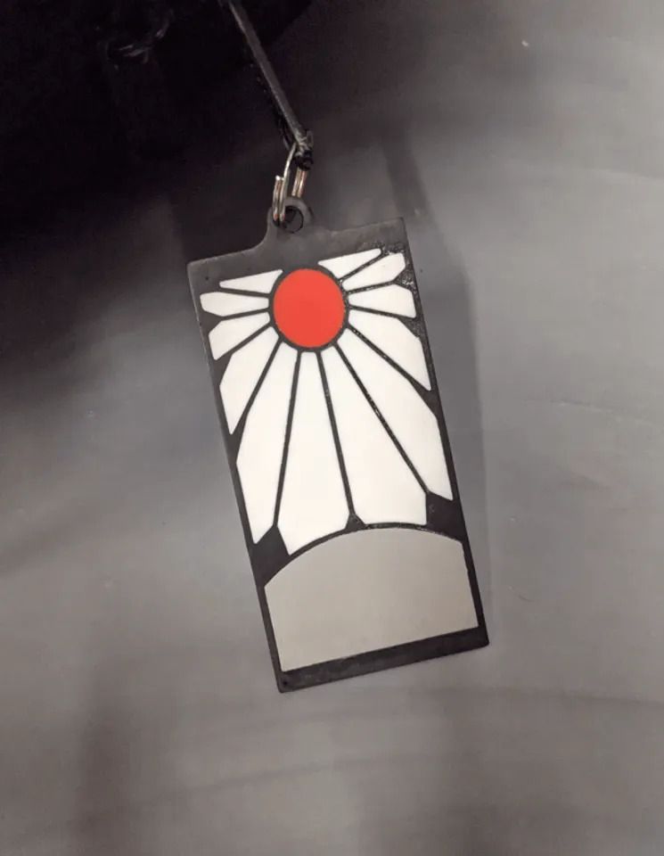 A close up of a tag

Description automatically generated
