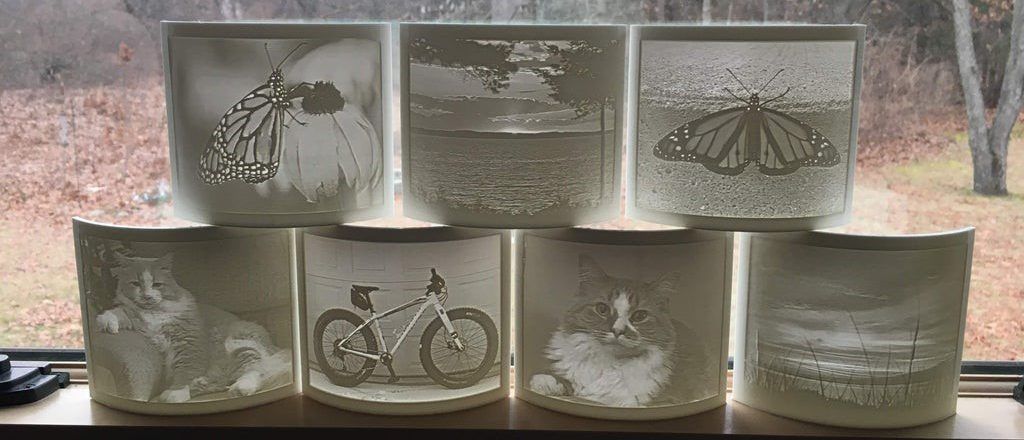 A group of pictures on a table

Description automatically generated