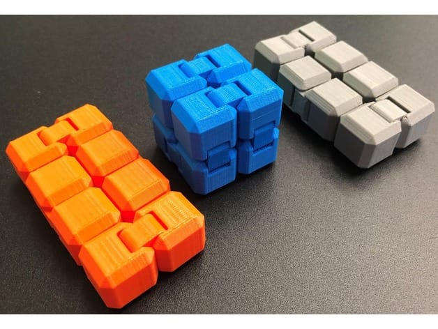 Colorful 3D printed fidget cube with tactile buttons and switches
