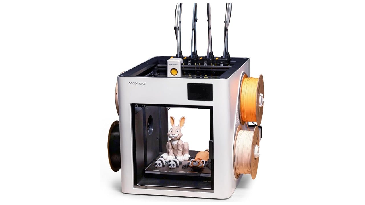 Snapmaker U1 four-toolhead 3D printer with multicolor printed figures on the build plate
