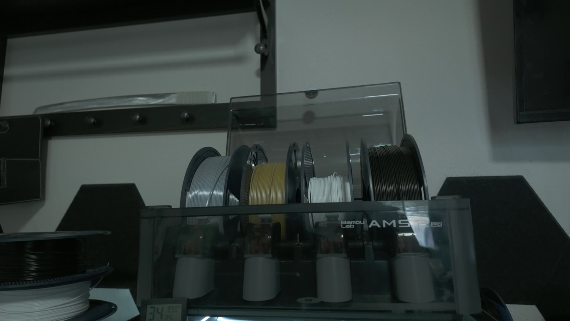 Four filament spools loaded in the Bambu AMS 2 Pro on top of the X2D