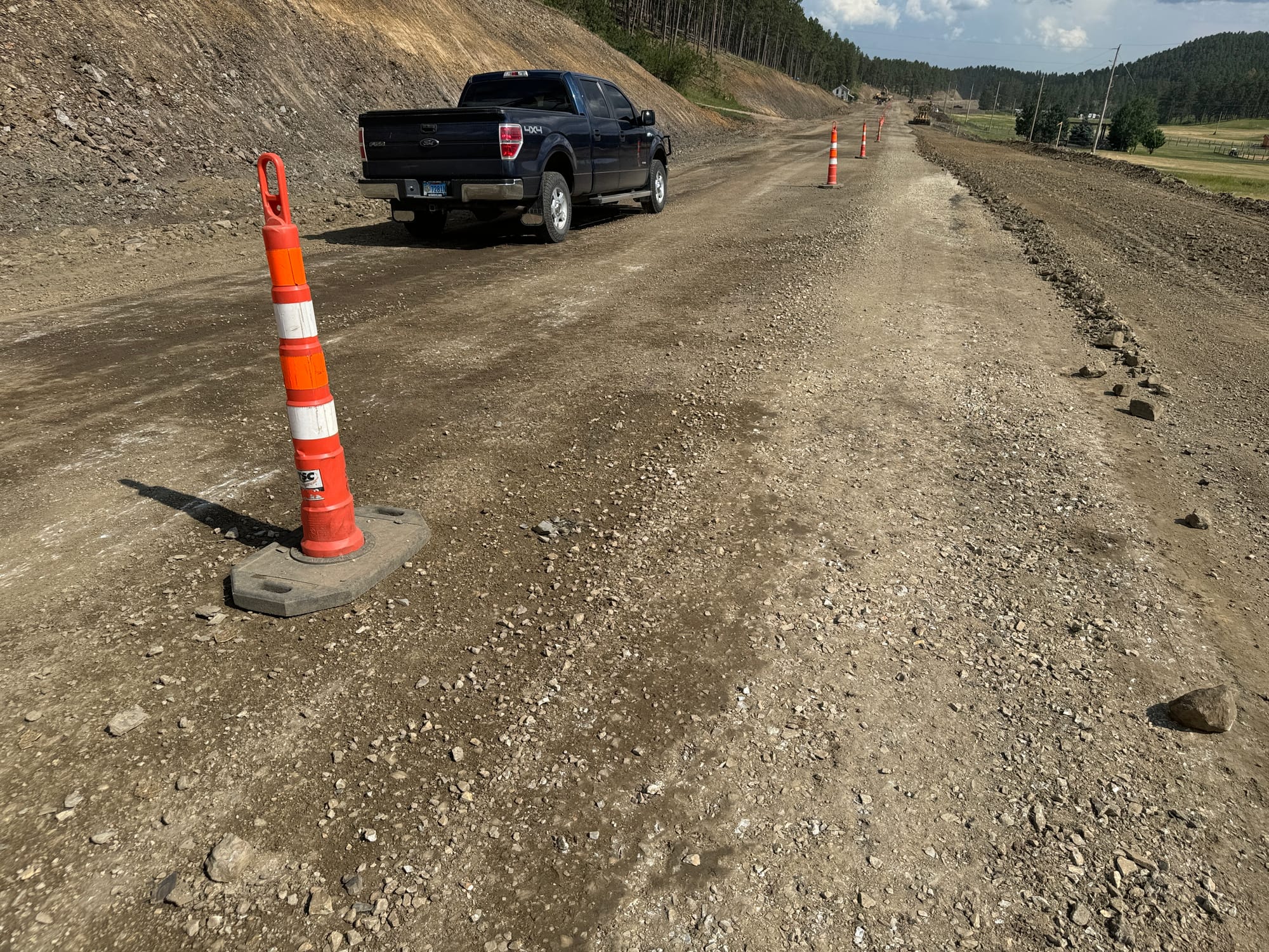 A pickup truck on a gravel road in Black Hills, South Dakota