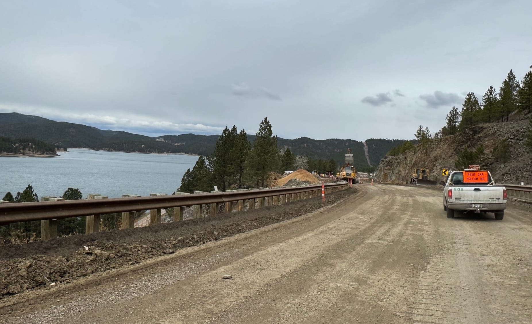 Crews work on US 385 in the Black Hills next to Pactola Lake
