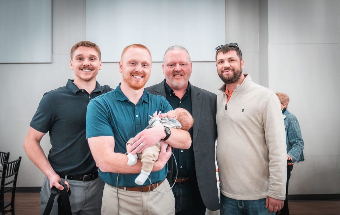 Toby Doden poses at the Brown County Republican Party Lincoln Day Dinner in Aberdeen, S.D., on April 10, 2025, with sons Johnny (far left) and Jackson (second from left). (Photo: Lakeside Media)