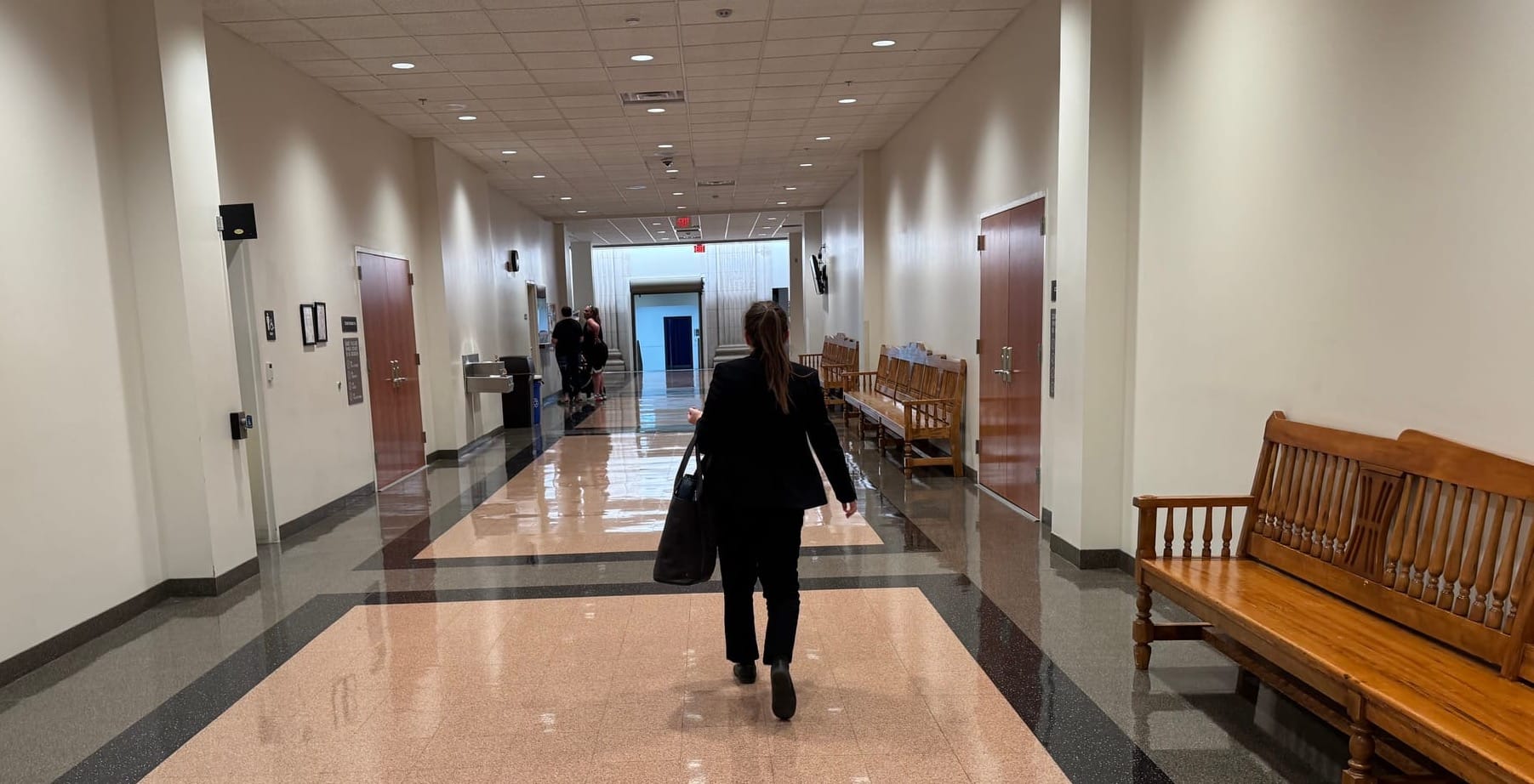 A lawyer walks through the Pennington County Courthouse in Rapid City