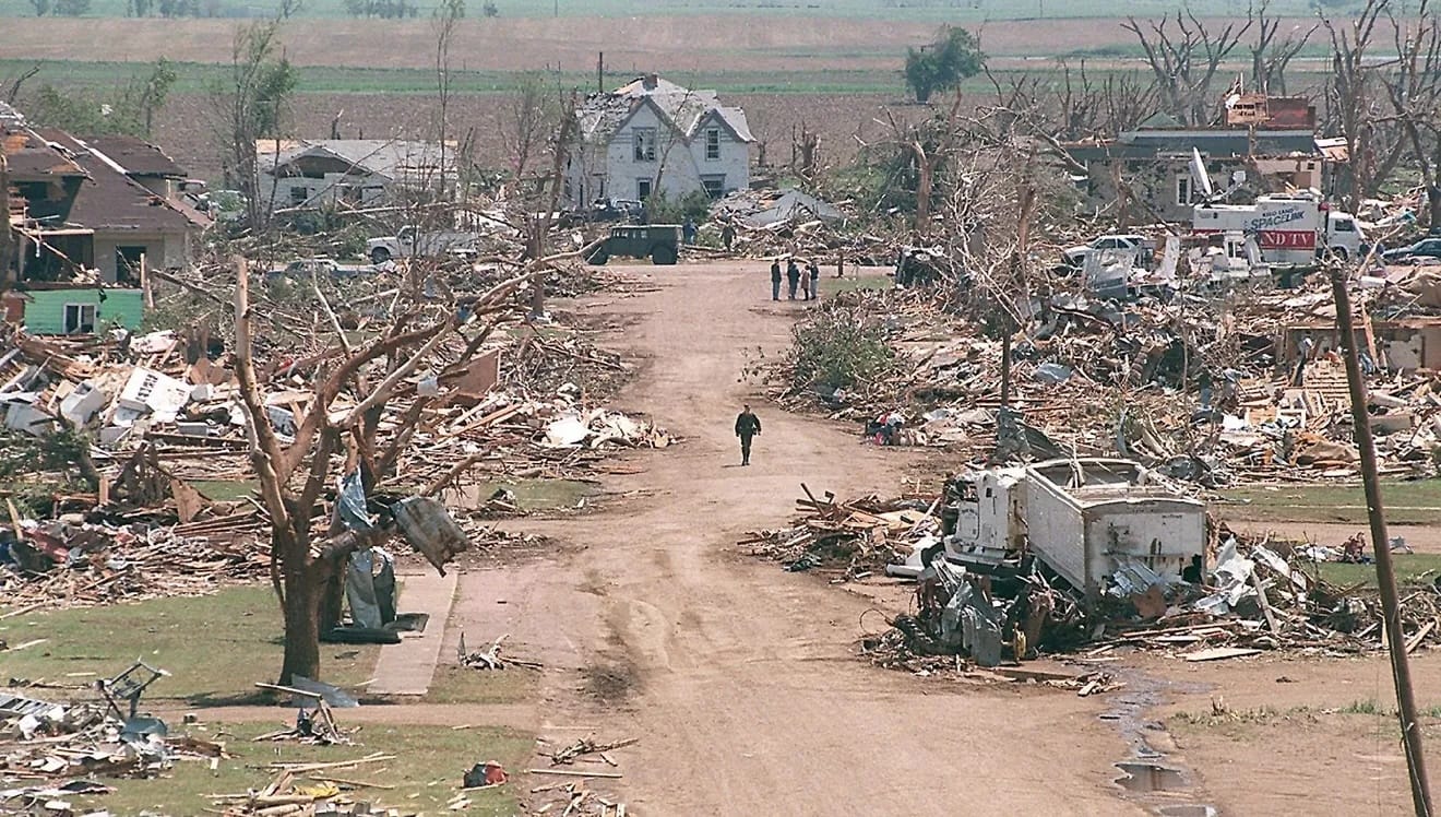 A National Guardsman walks down a street in Spencer surrounded by the devastation of the May 30, 1998, tornado.