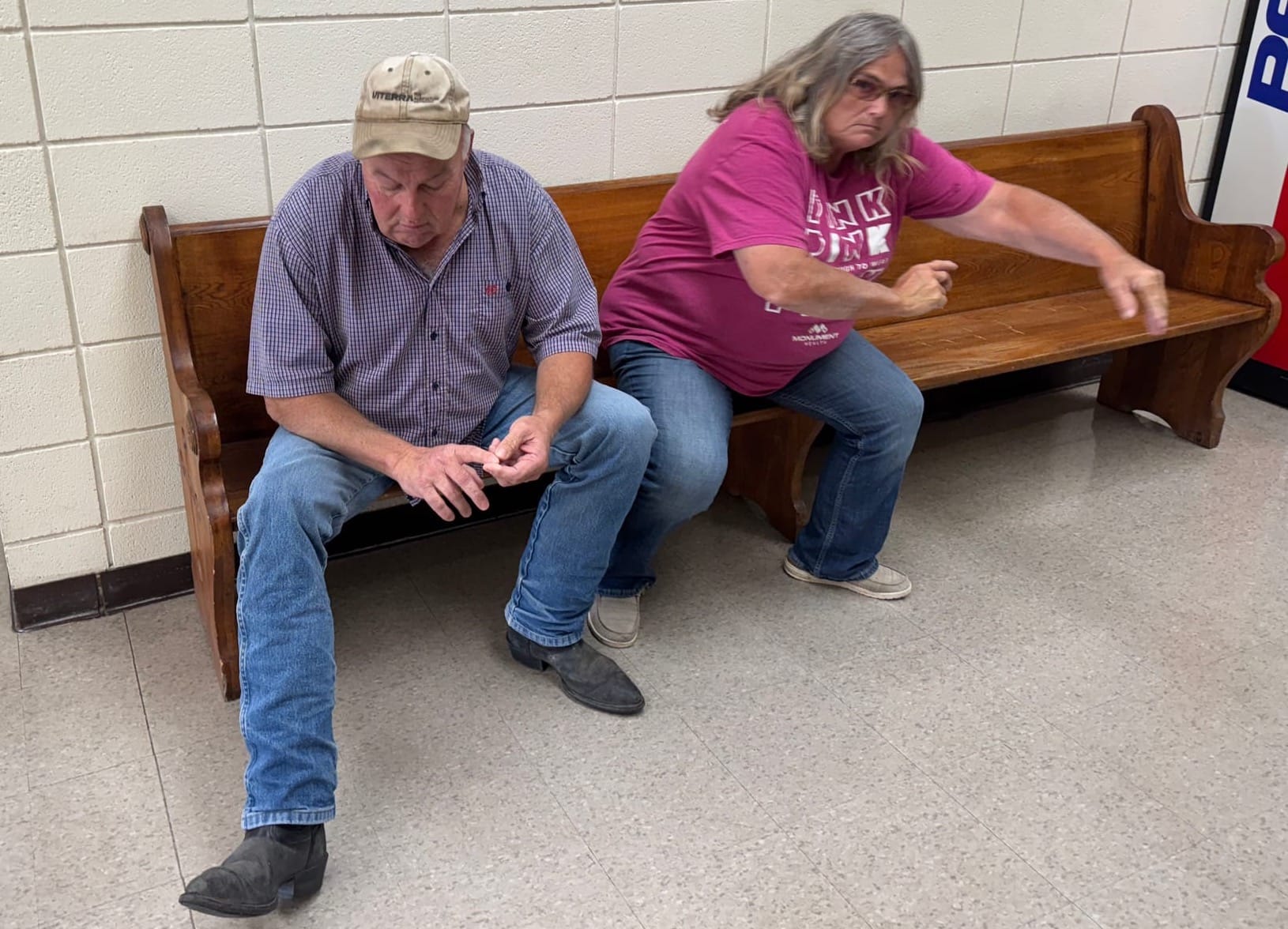 Leland Pauly and Lynda Frost of Martin, S.D. sit on a bench in the Bennett County Courthouse. 