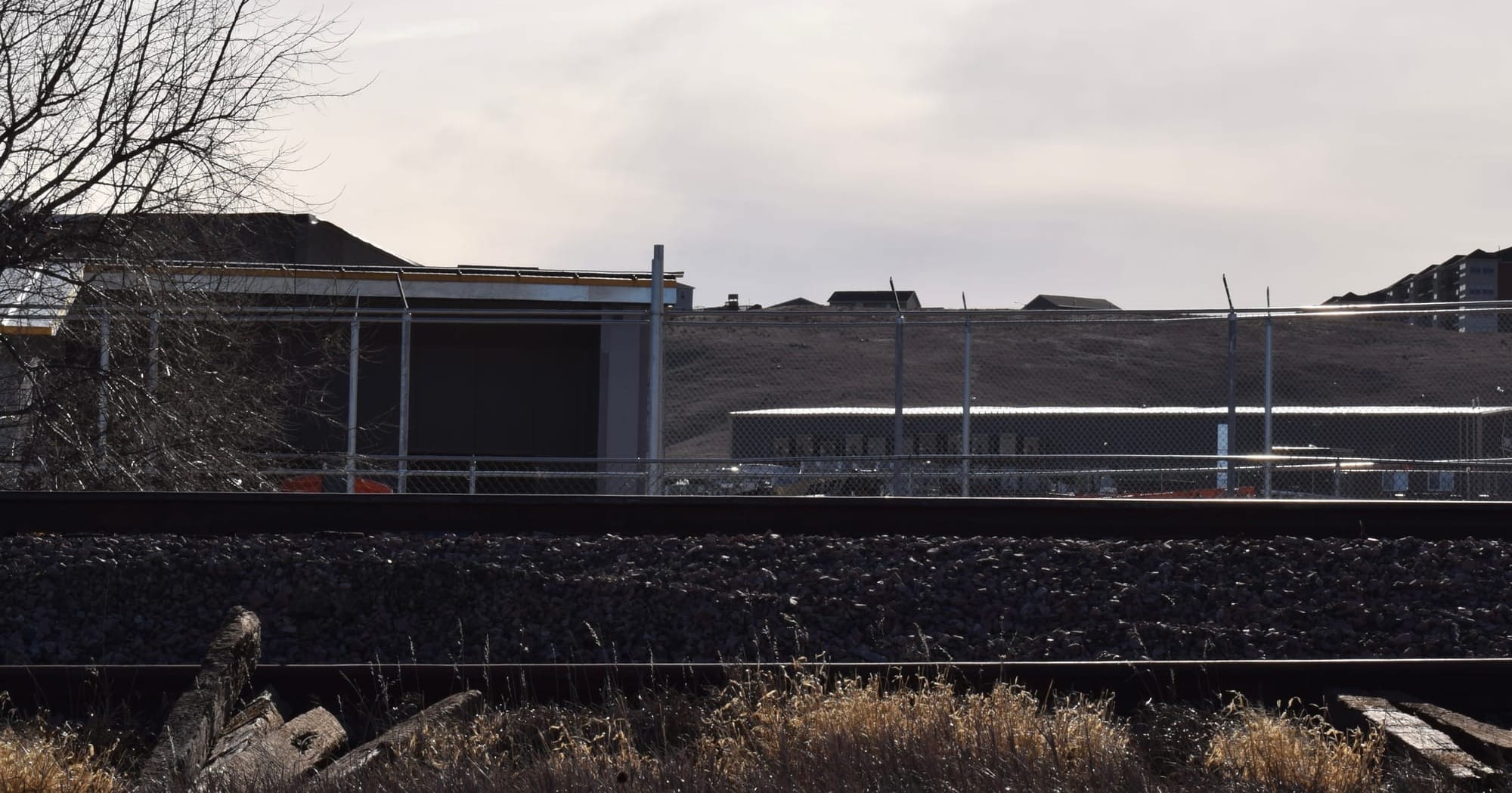 The exterior of the new women's correctional facility in Rapid City, S.D., with fencing surrounding it, on Dec. 18, 2025.