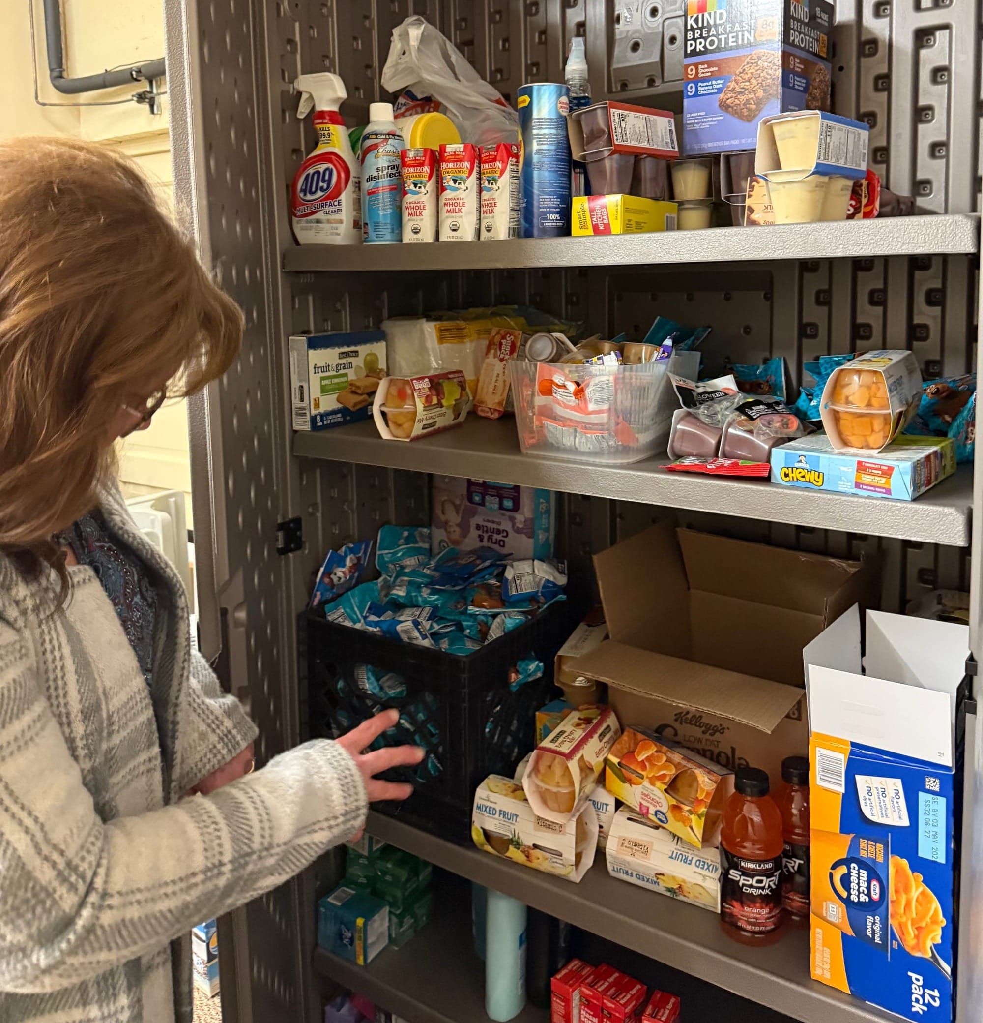 Volunteer Jackie Hofer displays food pantry donations in Centerville, S.D. on Feb. 11, 2026