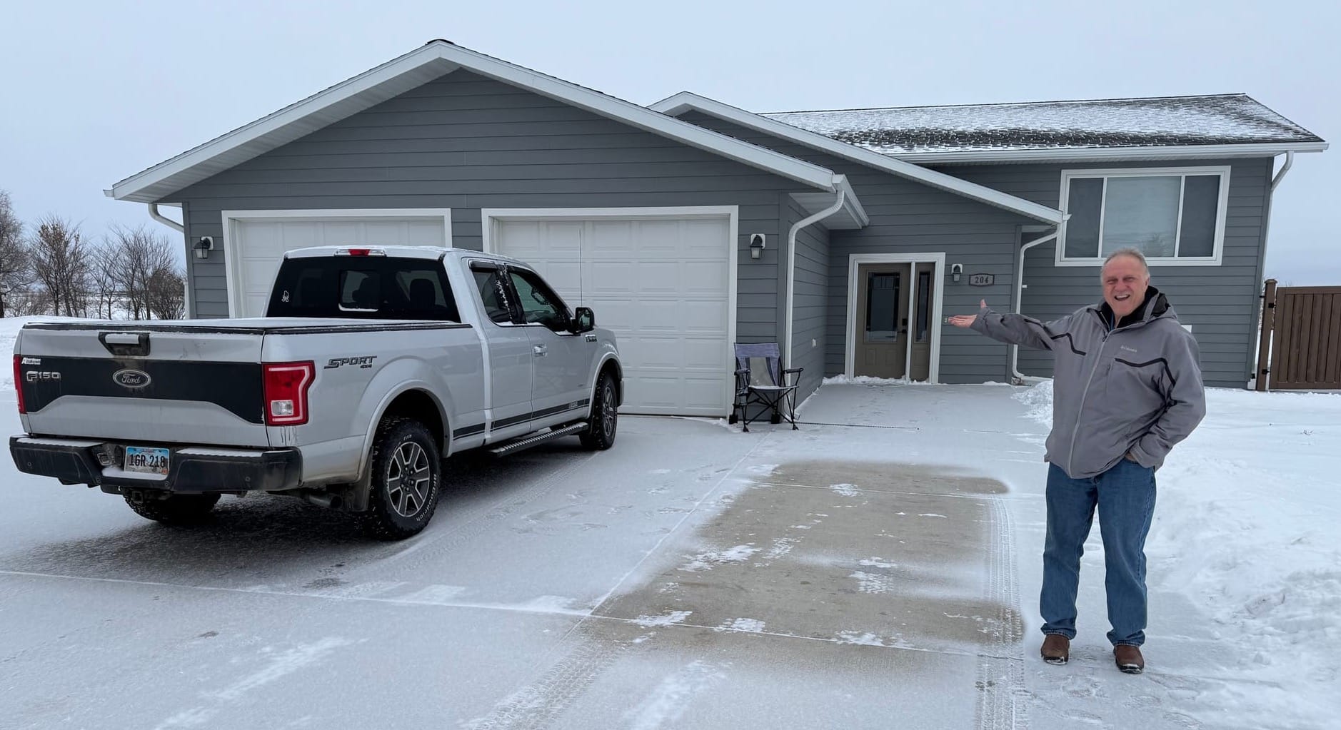 Dick Werner of the Herreid, S.D., housing development group, stood on Feb. 3, 2026, in front of an early "spec" home 