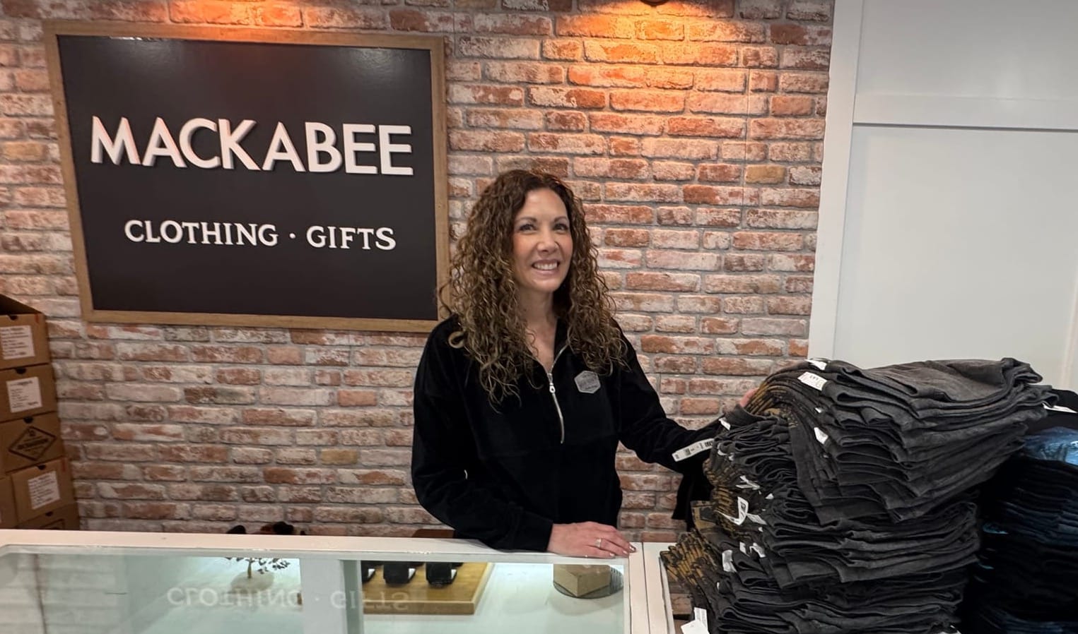 Bria Dillavou, owner of Mackabee Boutique in Keystone, S.D., was preparing shirts for display during the upcoming tourism season 