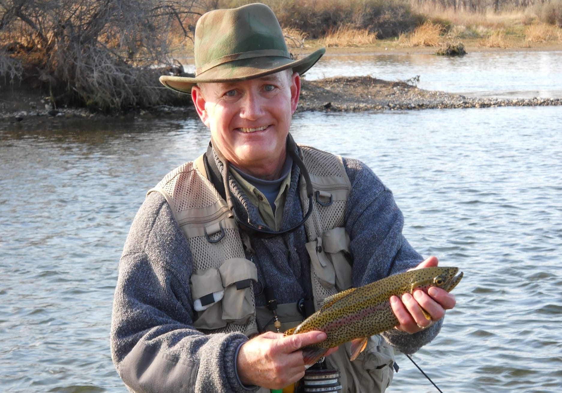 Tim Bjork holds a fish in a South Dakota river