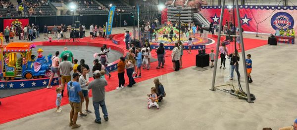 Families walk the circus floor in Brookings