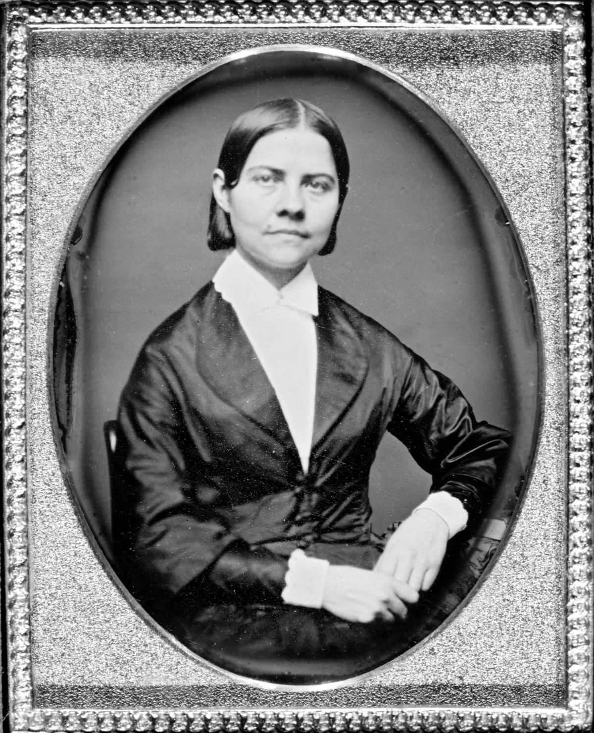 framed portrait photo of young Lucy Stone with direct, fearless gaze