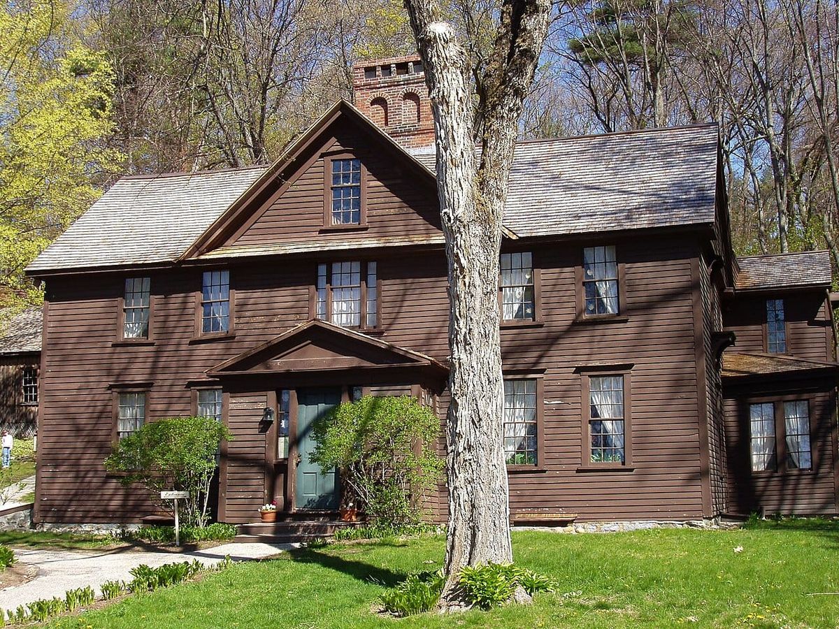 Orchard House, a brown wood two-story house with attic