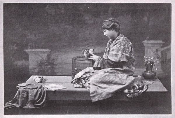 Smith seated in exotic attire in a theatrical setting