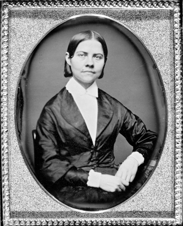 framed portrait photo of young Lucy Stone with direct, fearless gaze