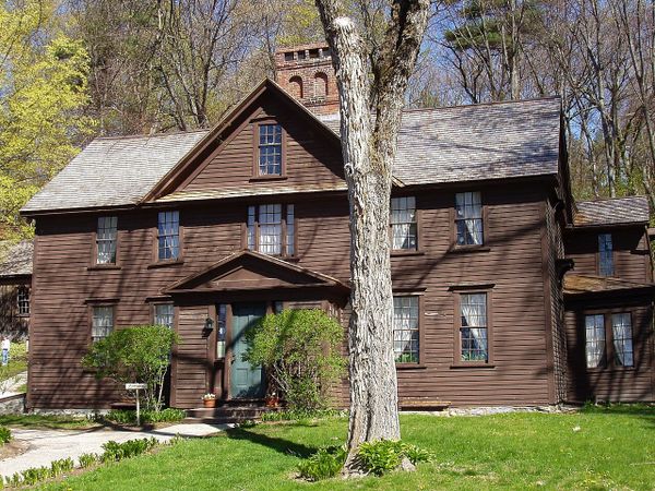 Orchard House, a brown wood two-story house with attic
