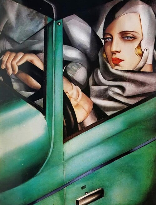 It’s a cool Art Deco-style paintin of a lady in a green car. She’s got a neato white cap on & ruby red lips & big dreamy eyes & cream-colored driving gloves. Basically she just looks REALLY COOL is what I’m sayin.