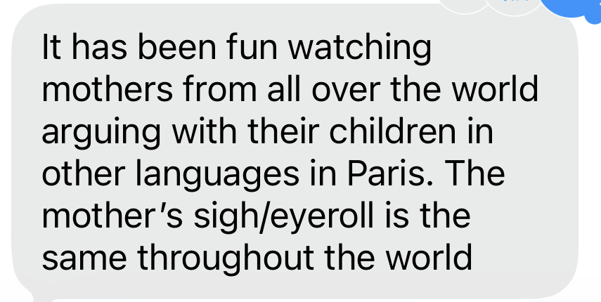 A text message reading "It has been fun watching mothers from all over the world arguing with their children in other languages in Paris. The mothers' sigh/eyeroll is the same throughout the world."