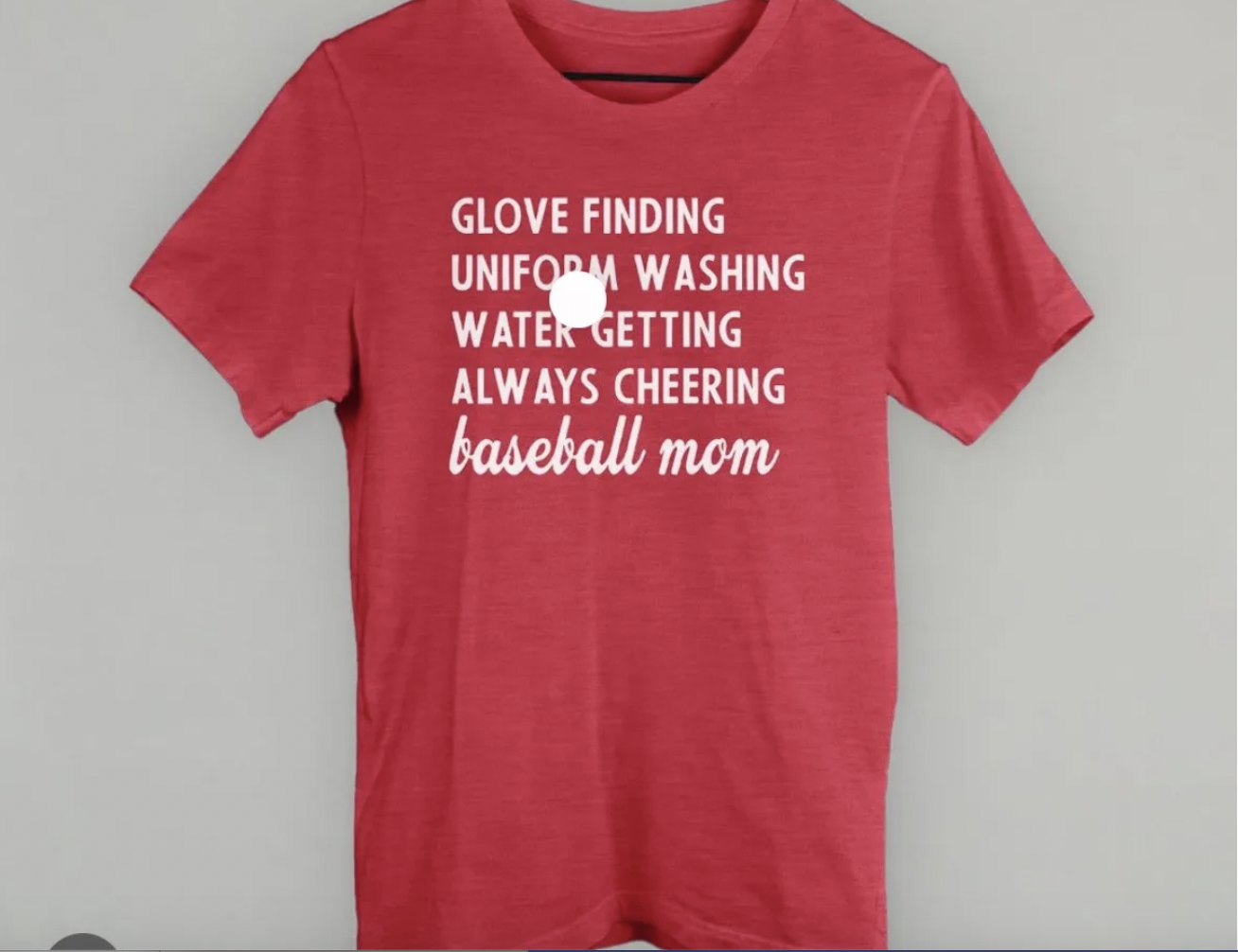A red tee shirt that says "glove finding uniform washing water getting always cheering baseball mom"