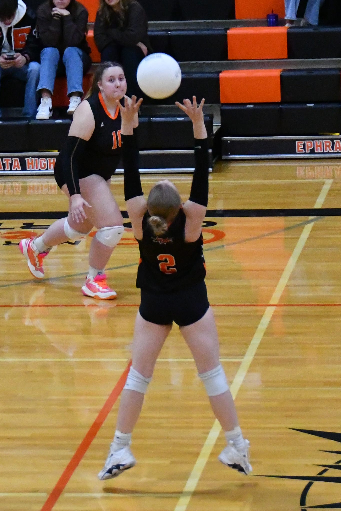 Ephrata’s Alyssa Dymarkowski (2) delivers a set to Briayer Fisher (10) for a front-row attack against Othello.