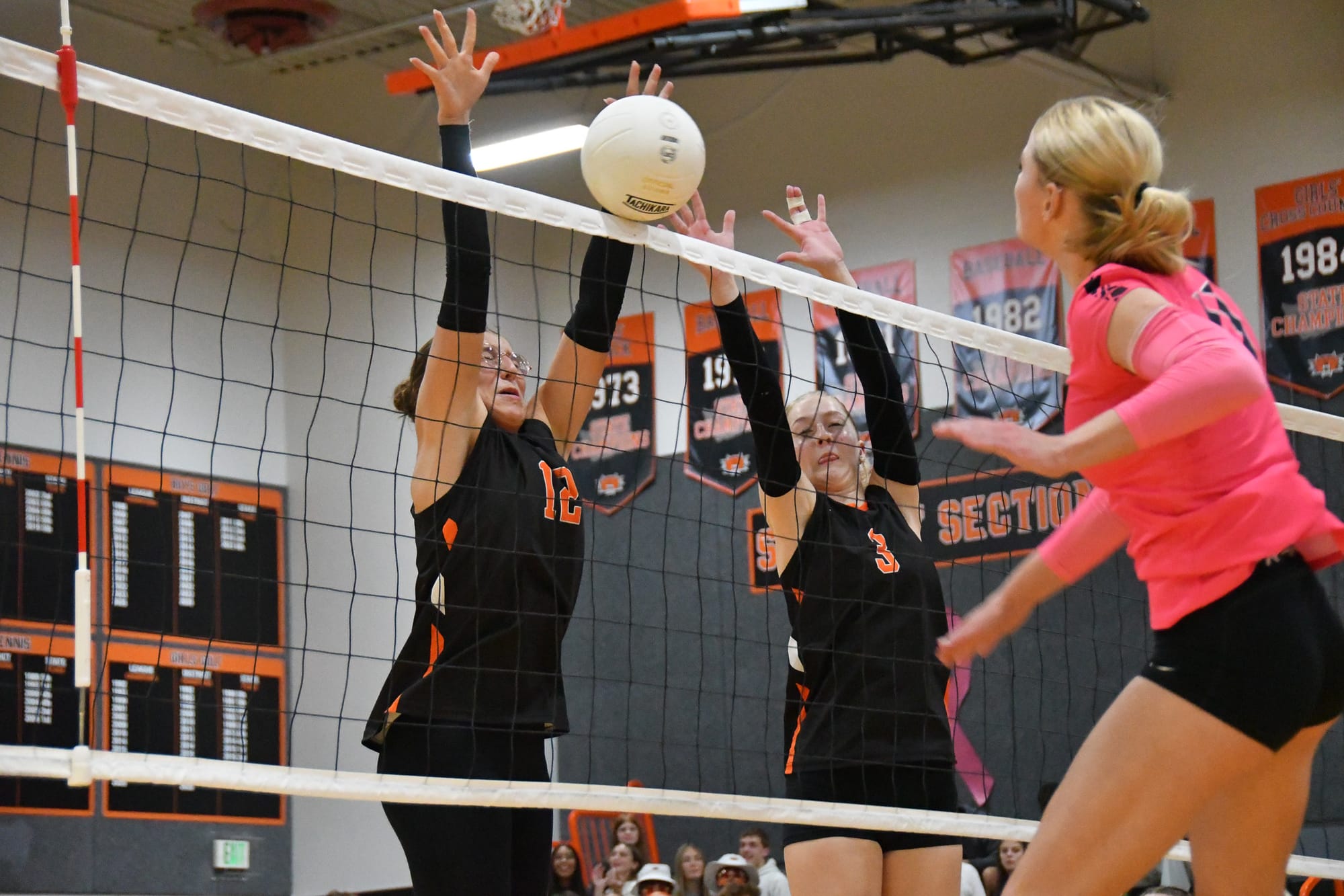 Ephrata’s Addison Vasquez (12) and Alexis Chornuk (3) team up for a block against an Othello attack.