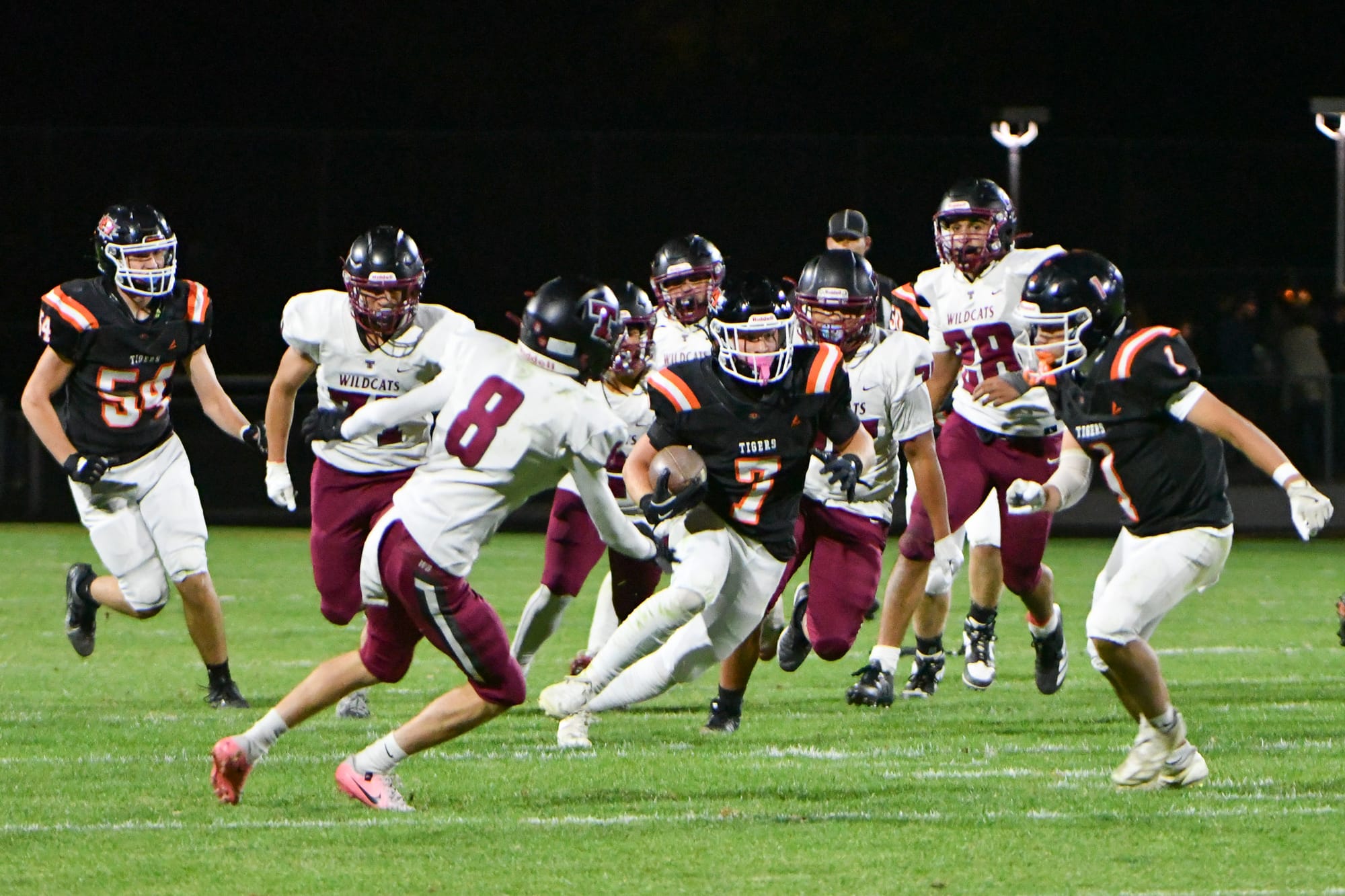 Chance Lee (7) finds an open lane with Hunter Mills (1) providing blocking support.