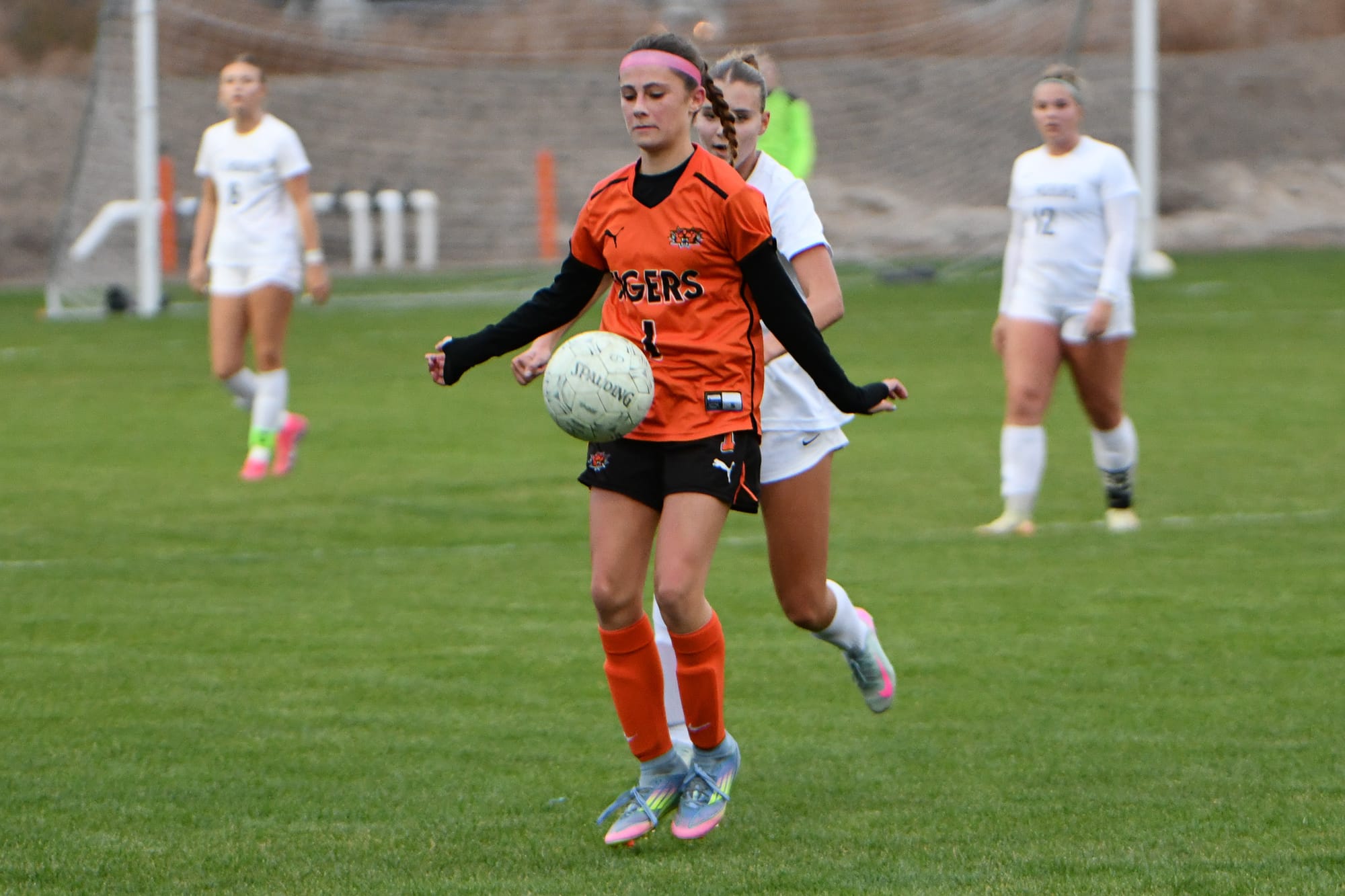 Tiger defender Sophie Molitor (1) blocks the ball during district play against Ellensburg.