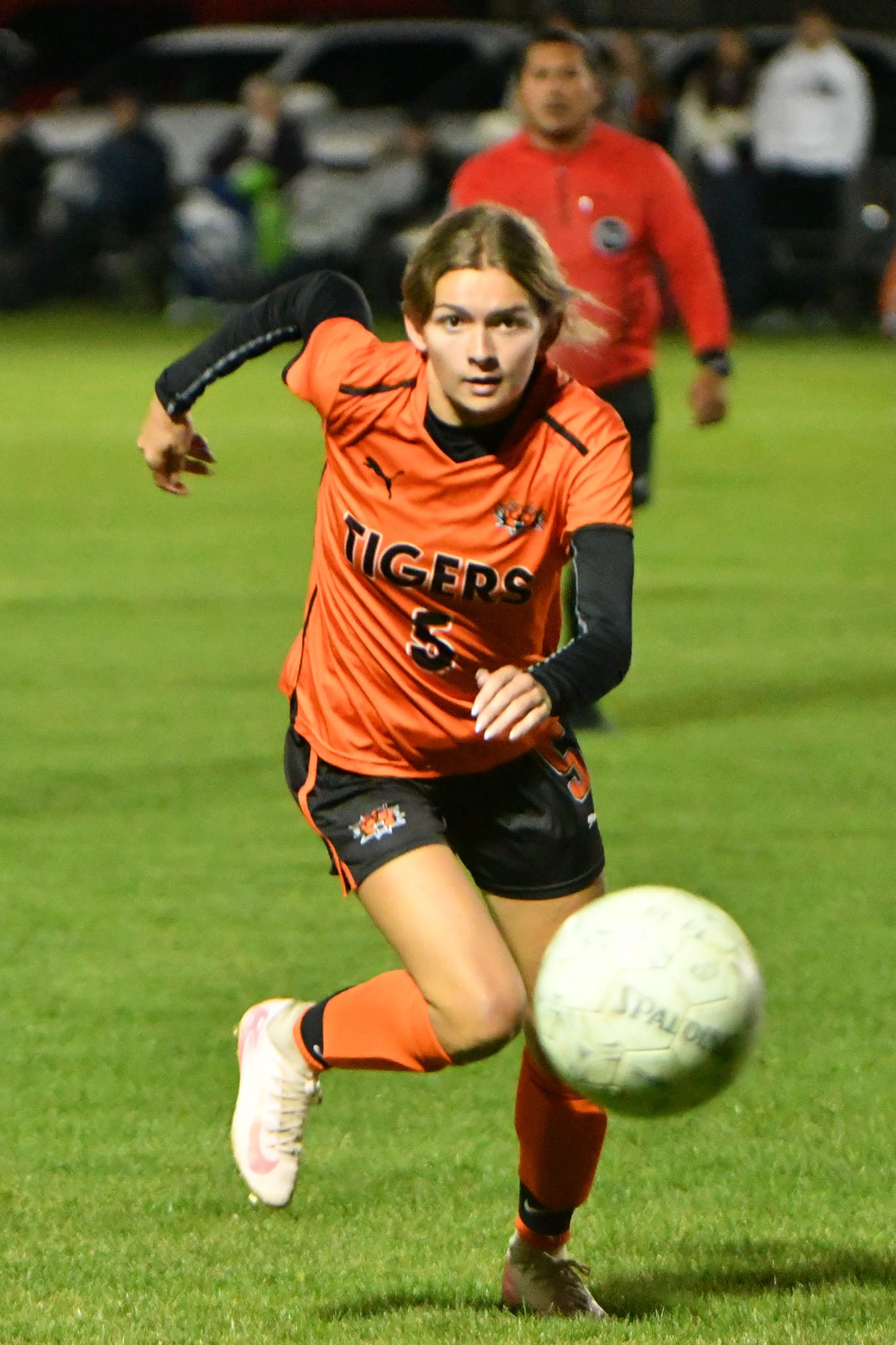 Tiger Jill Linehan (5) tracks down the ball in the final minutes of the district elimination game.