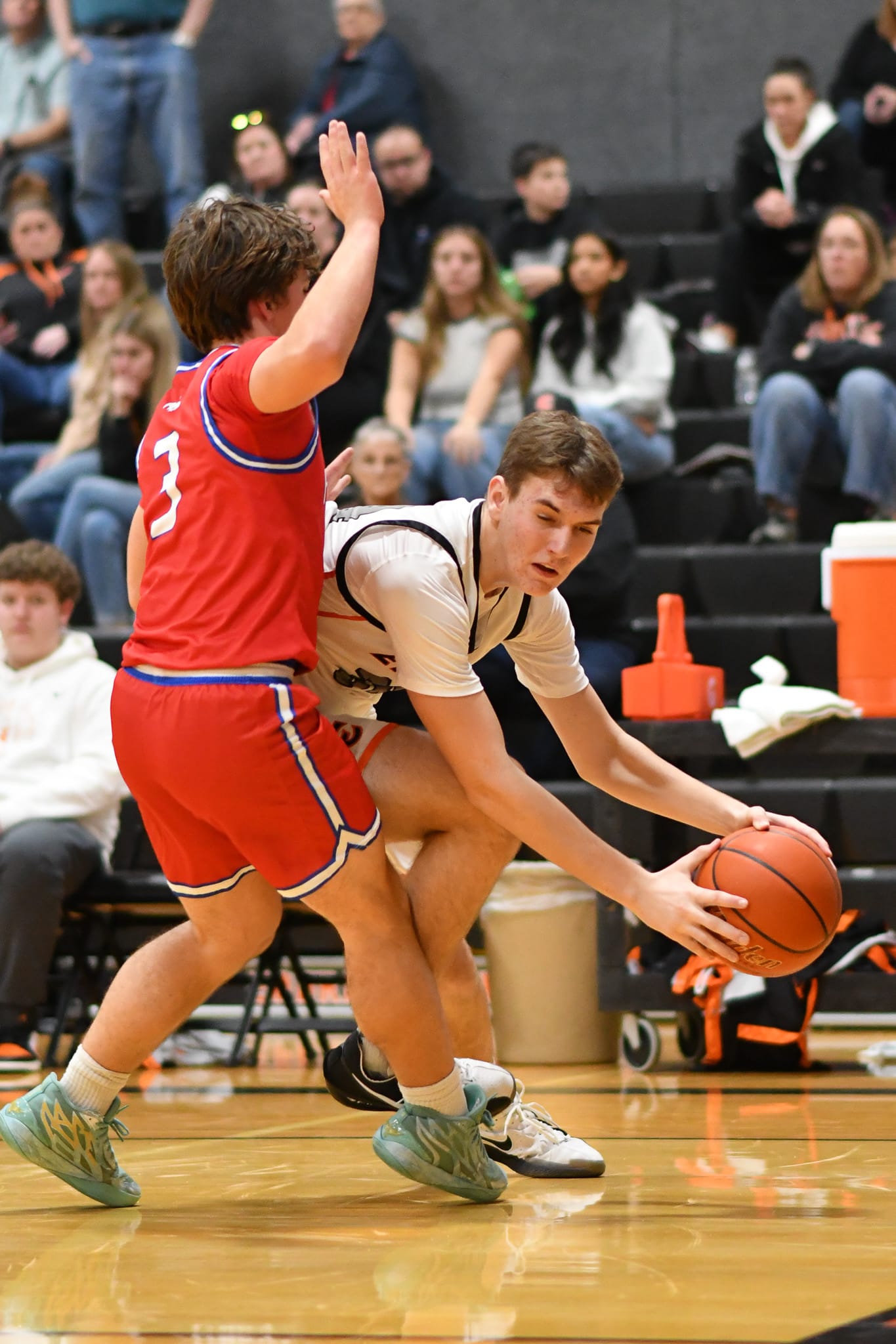  Benson Bair (34) attempts a baseline drive around Prosser's Carson Anderson (3).