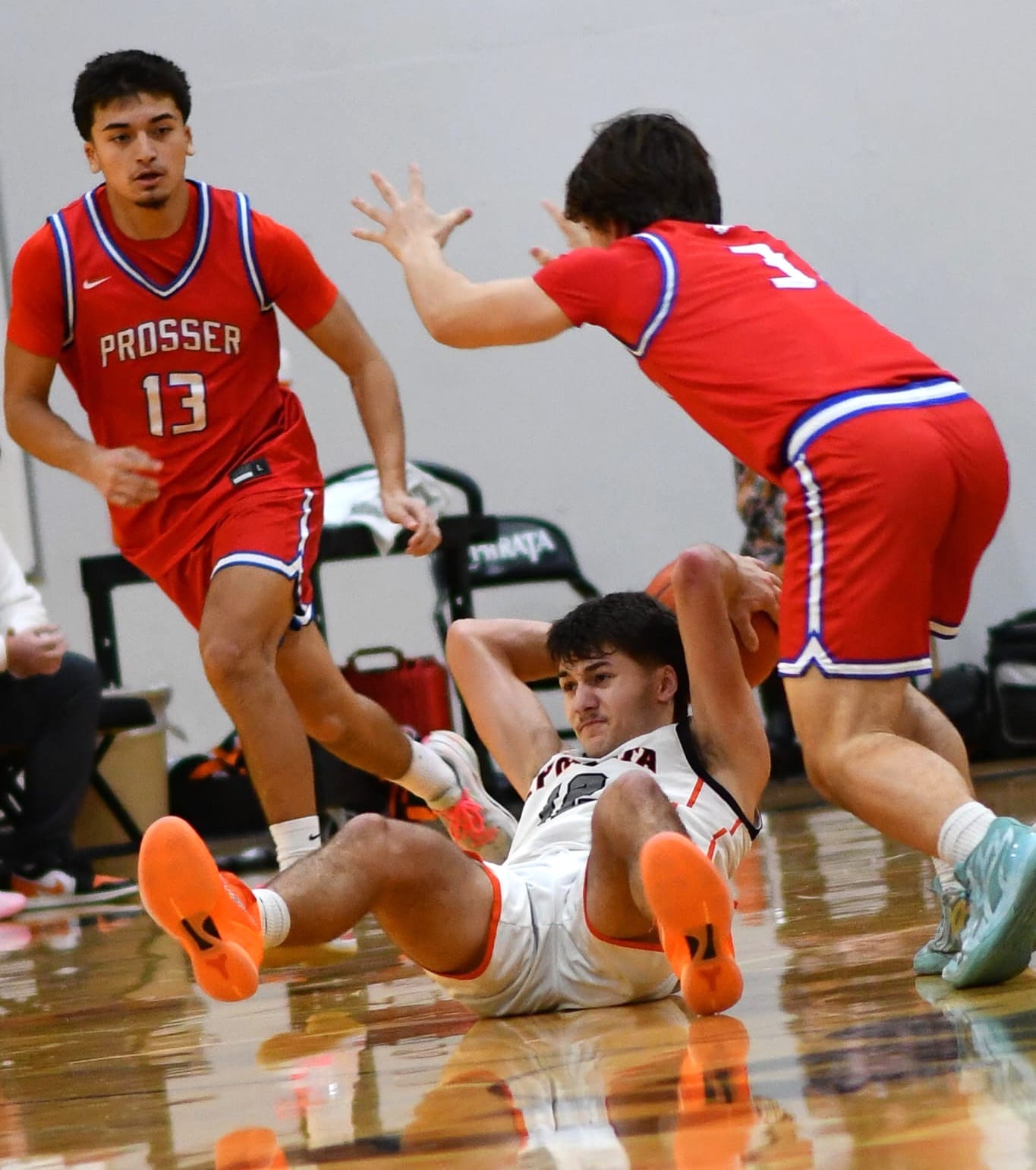 Brady Hendrick (12) attempts a pass from the floor.