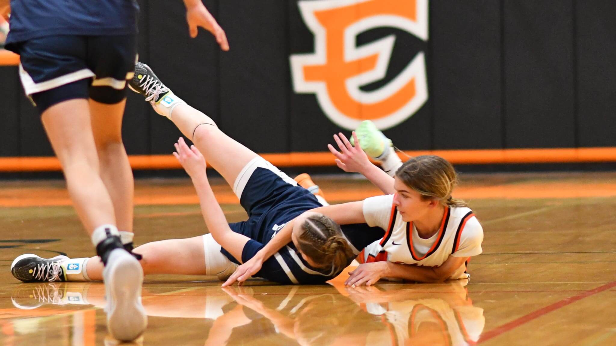 Jill Linehan (14) scraps for a loose ball against a Selah defender. Linehan led the Tigers with eight points in Thursday's loss at Quincy.