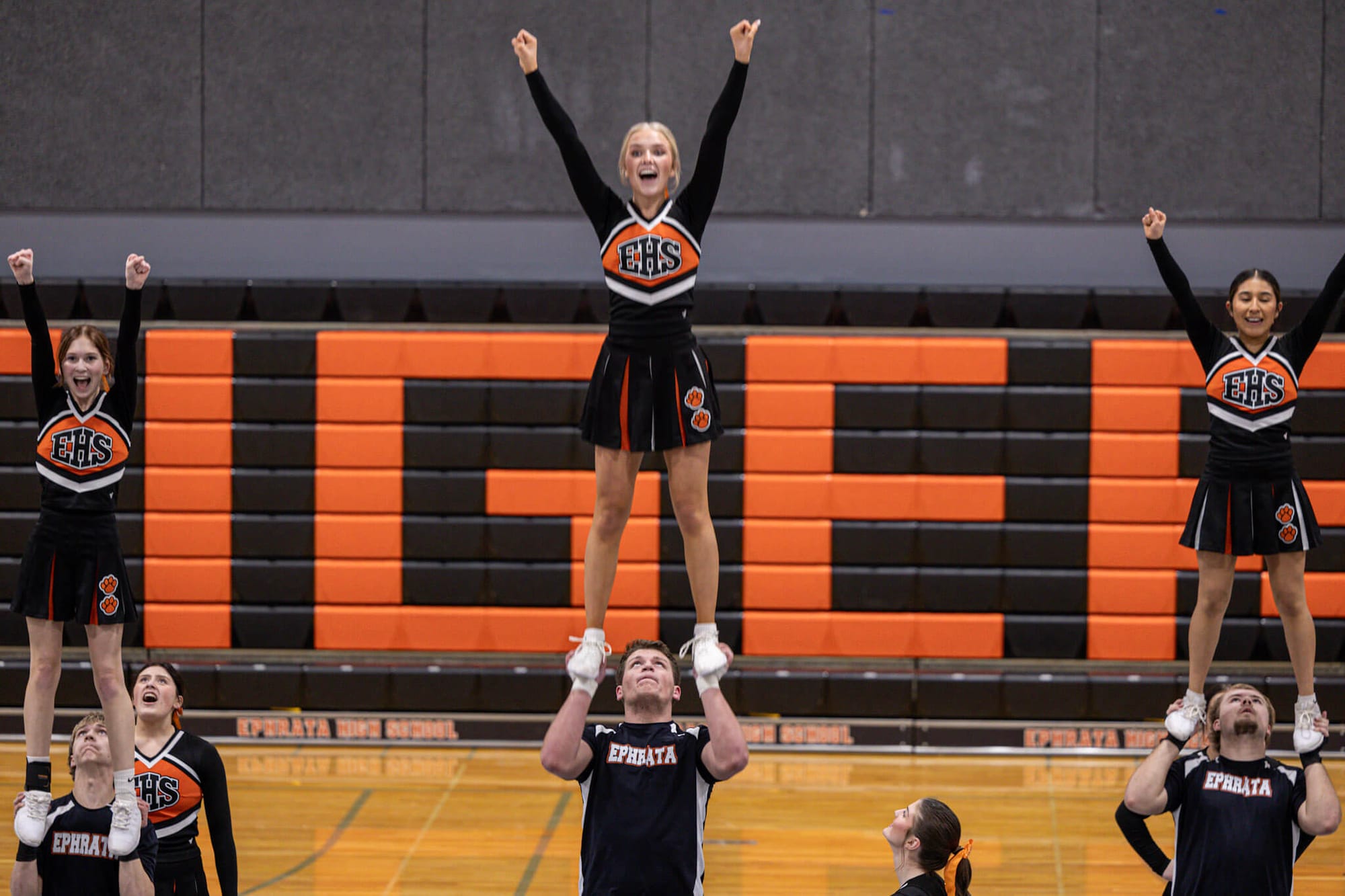 From left, stunt partners Isabelle DeHerrera and Charles Poirrier, Annjolenn Ahmann and Michael Park, and Amalya Bastida and Brody Fleurkens hold prep lifts during the team's showcase.
