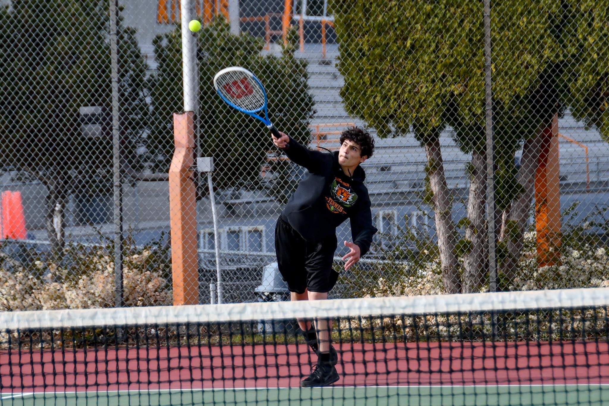 Jeremiah Alvarez leaps for an overhead smash during Ephrata's home match against Ellensburg. Alvarez and partner Ben McLain were a boys' bright spot of the week, beating Ellensburg's James Garcia and Cass Welsh 6-2, 6-2 at 2nd doubles.