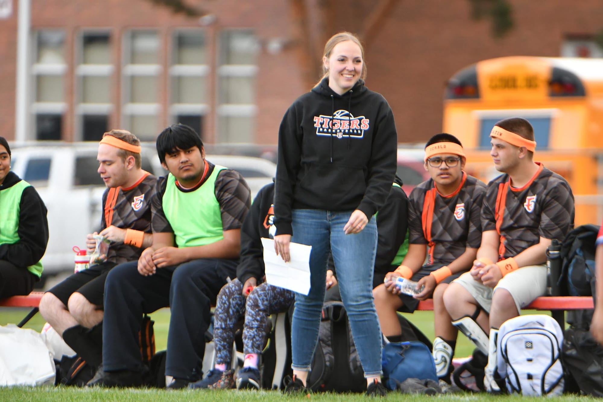 Coach Alanna Peterson works the bench during Thursday's match.