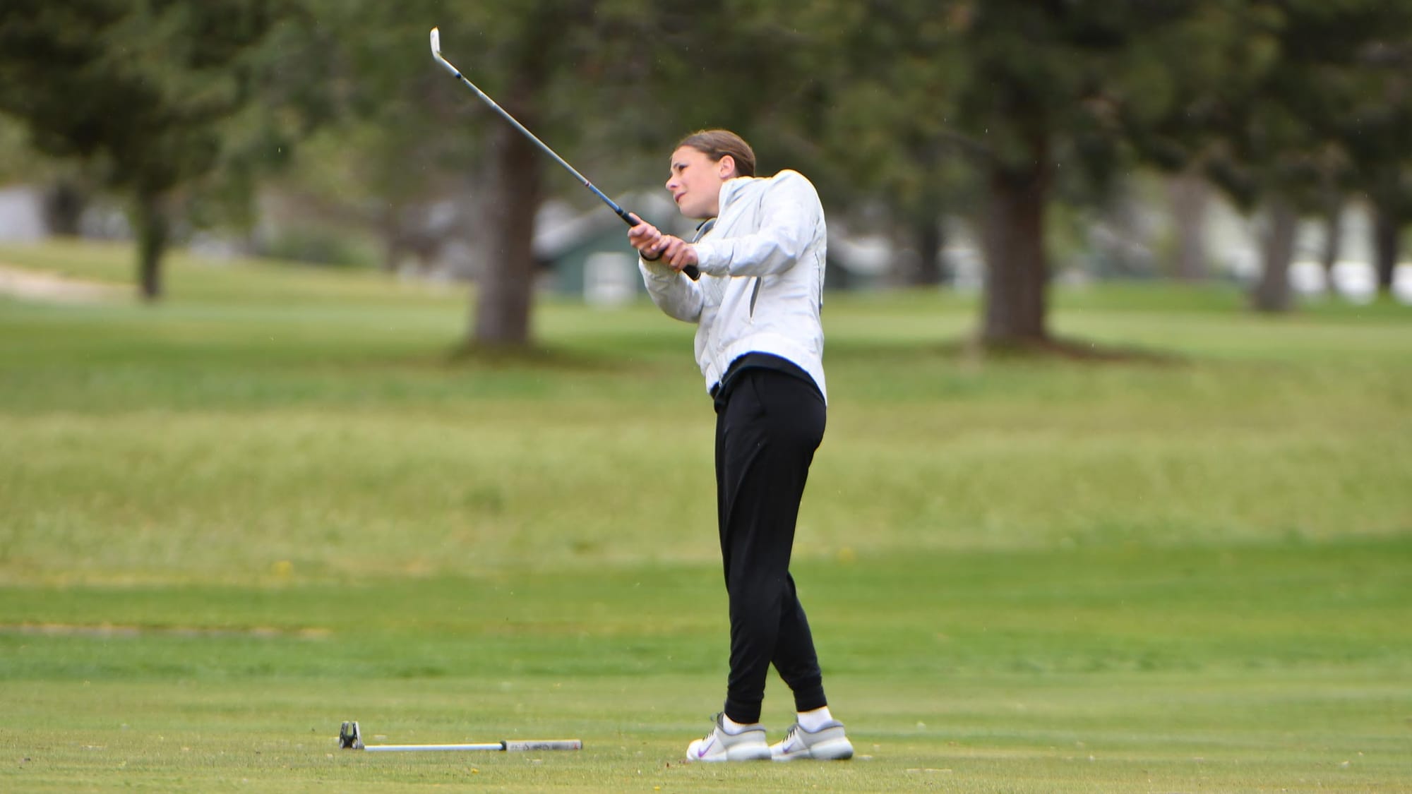 Ephrata's Sophie Molitor chips onto the green at an earlier Lakeview Golf and Country Club match with Chelan on April 14. The freshman won the CWAC girls golf championship with a season-best 87. Photos by Casey and Owen Devine