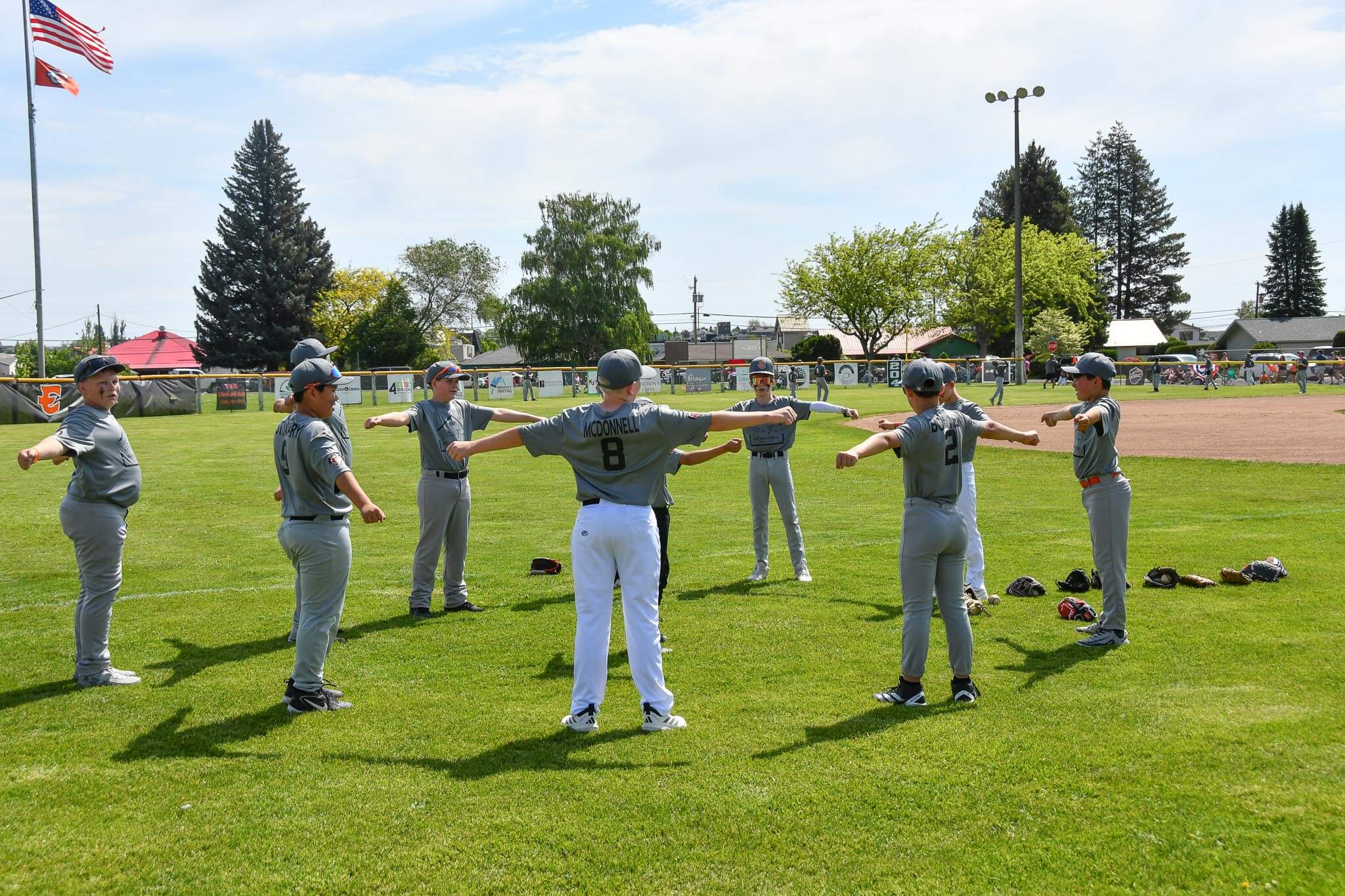 A team runs through stretches before taking the field on opening day.
