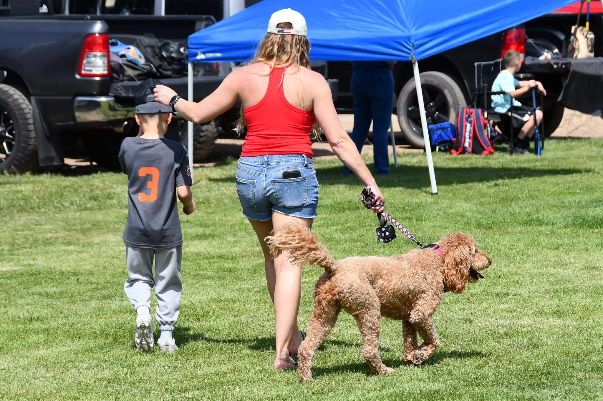 A family takes a lap with the dog.