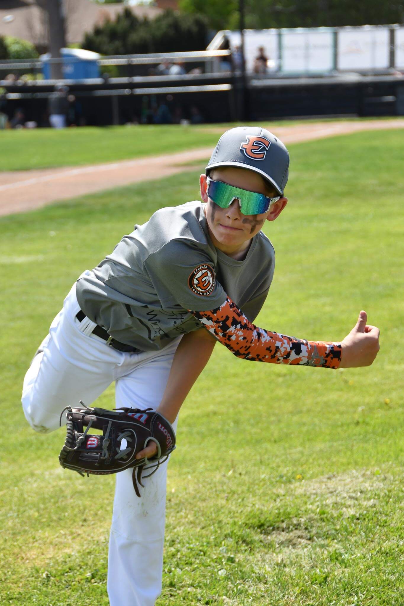 A pitcher from Windermere Staci Faw works through warm-ups in the bullpen.