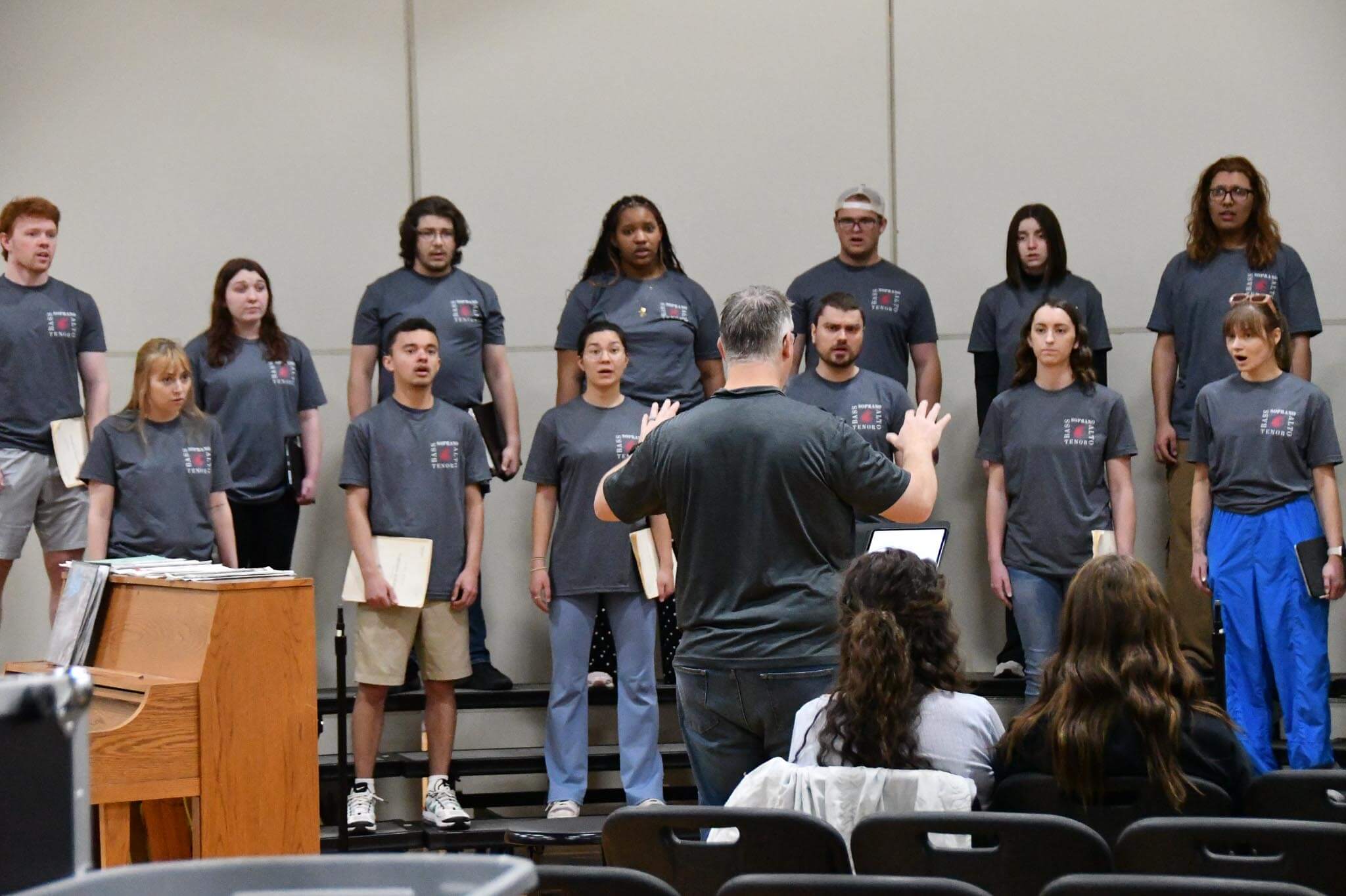 Dr. Luethi leads the WSU Concert Choir through a song.