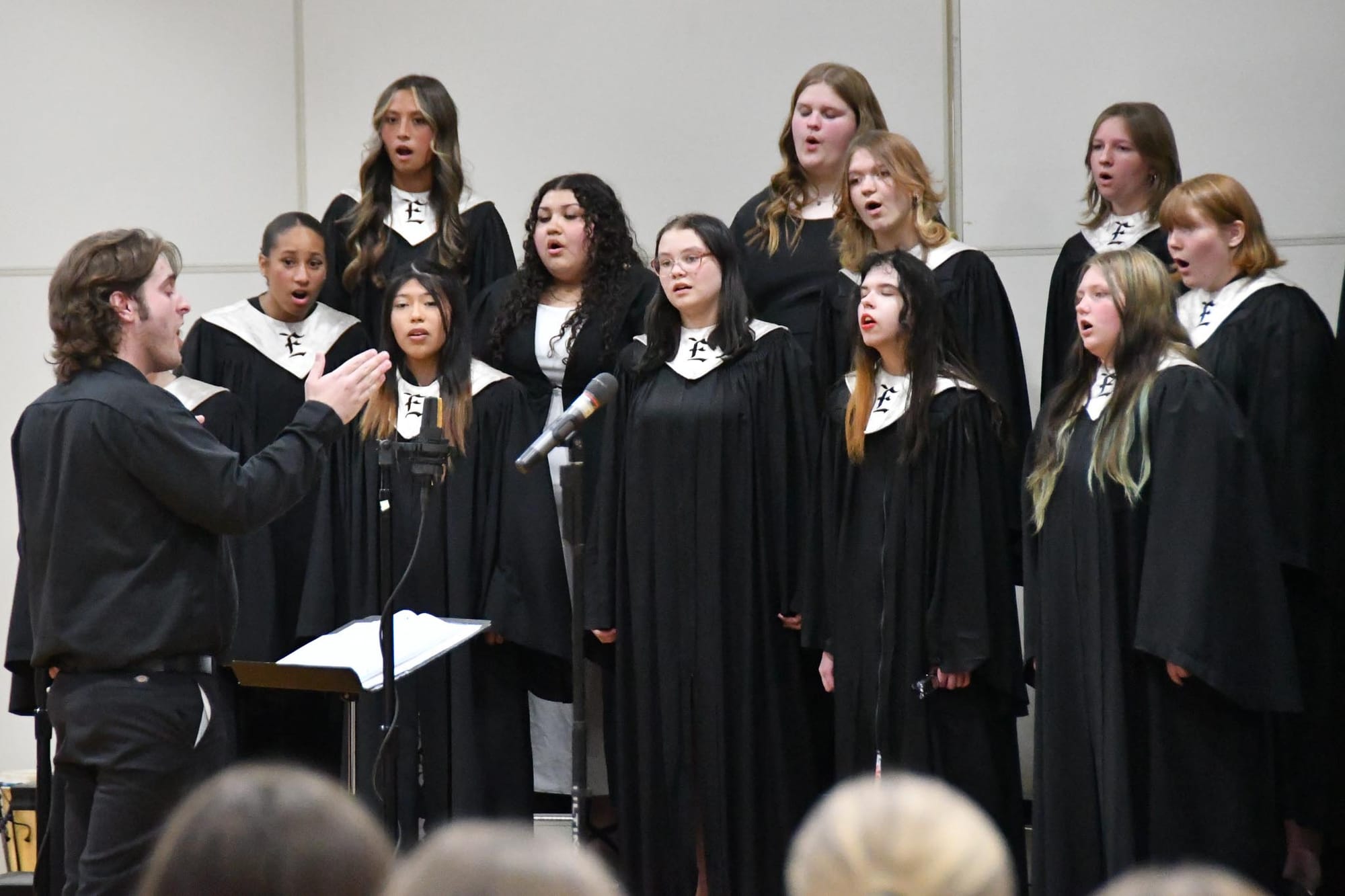 Gus O'Donnell (left) directs the EHS Treble Clef Choir during Multi-Arts Festival.