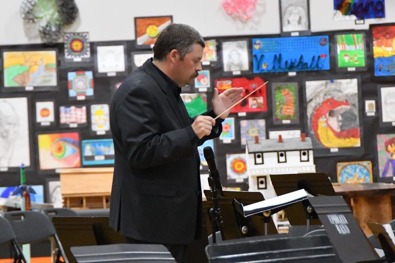 Ephrata School District bands director Jacob Pearce conducts during Tuesday's band concert.