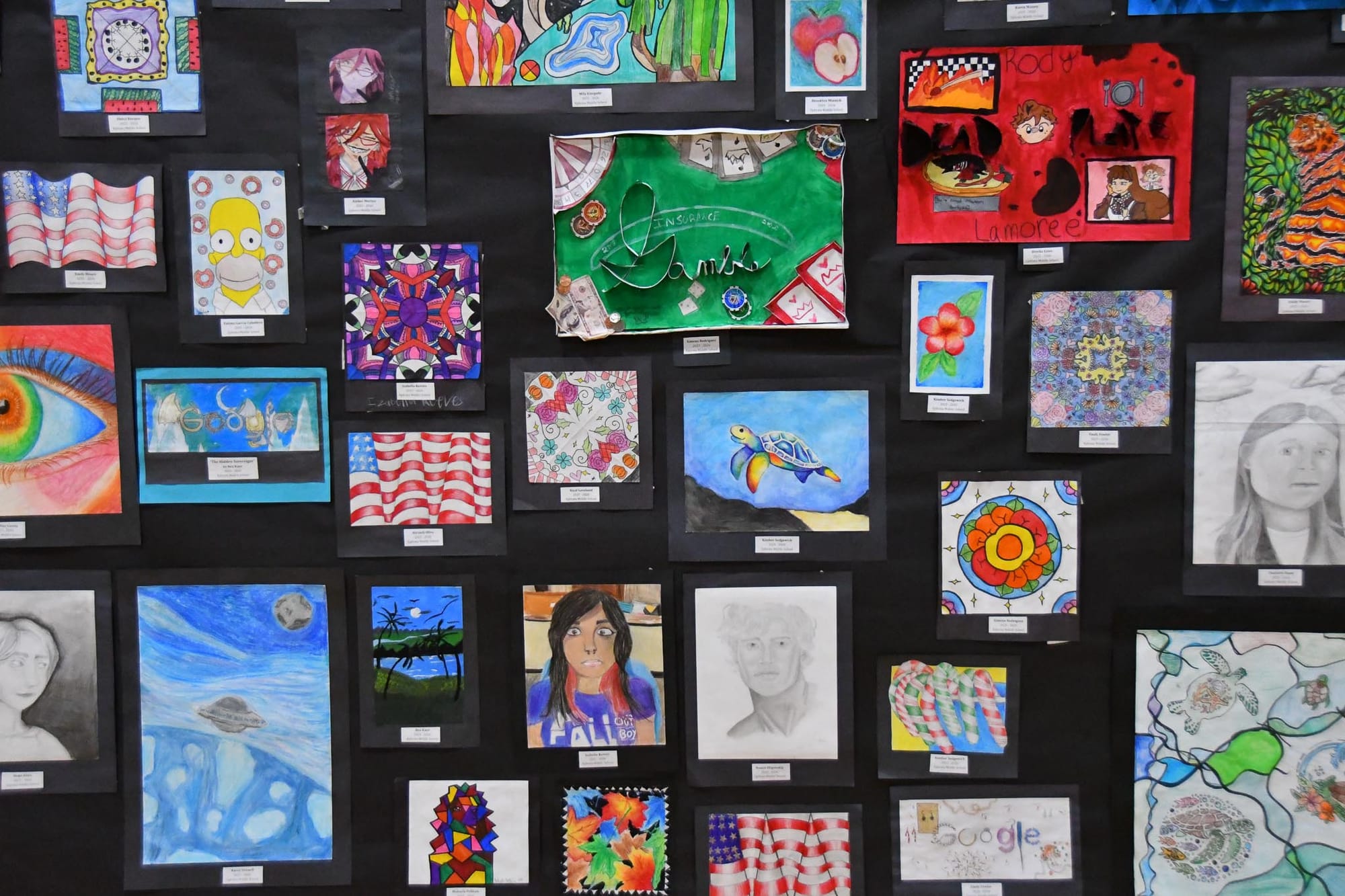 Drawings, paintings and mixed-media pieces from EMS art students filled multiple walls of the EHS gymnasium throughout the festival week.