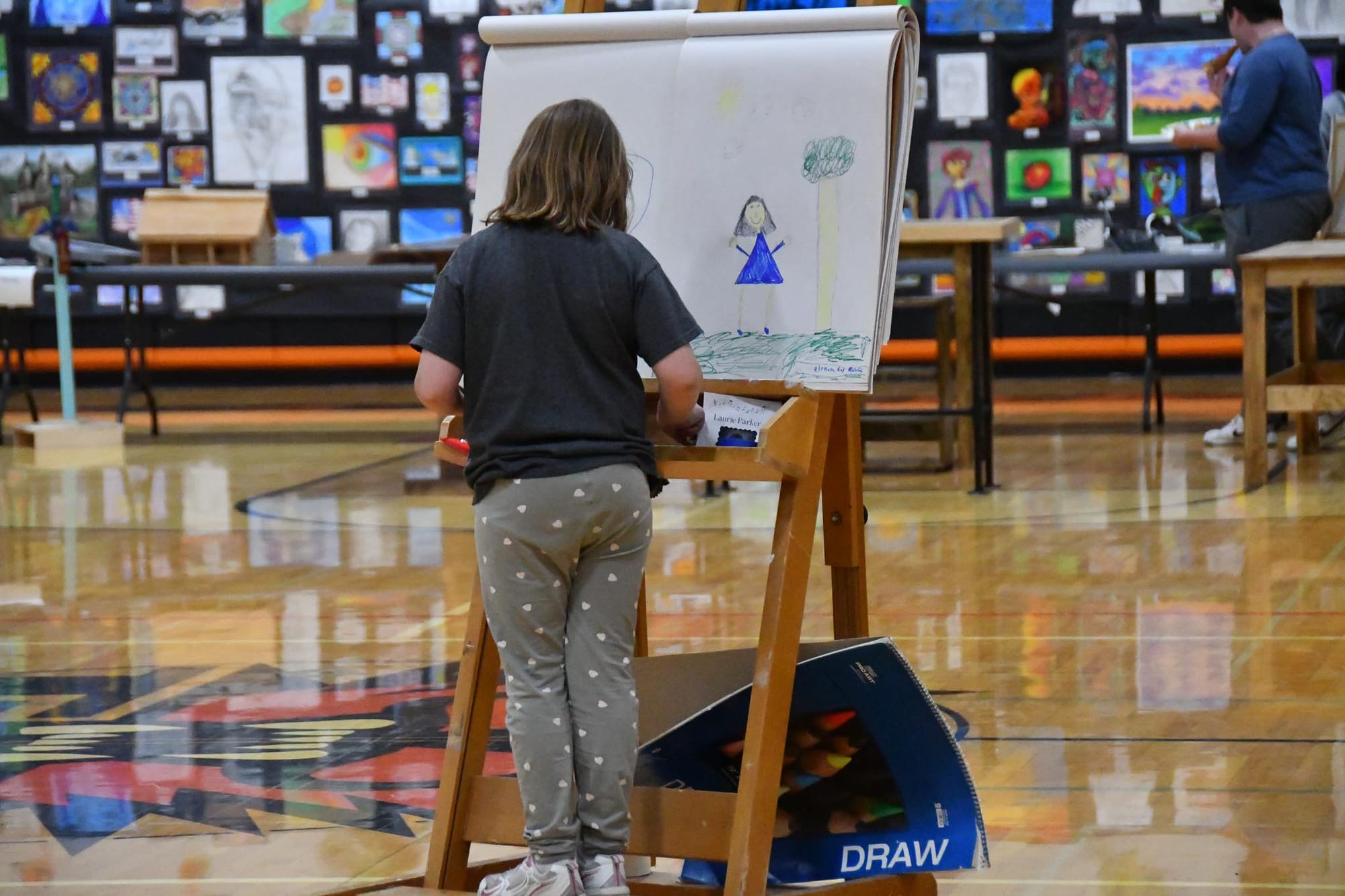 The festival included a hands-on easel station where visitors of all ages could try their hand at making art.
