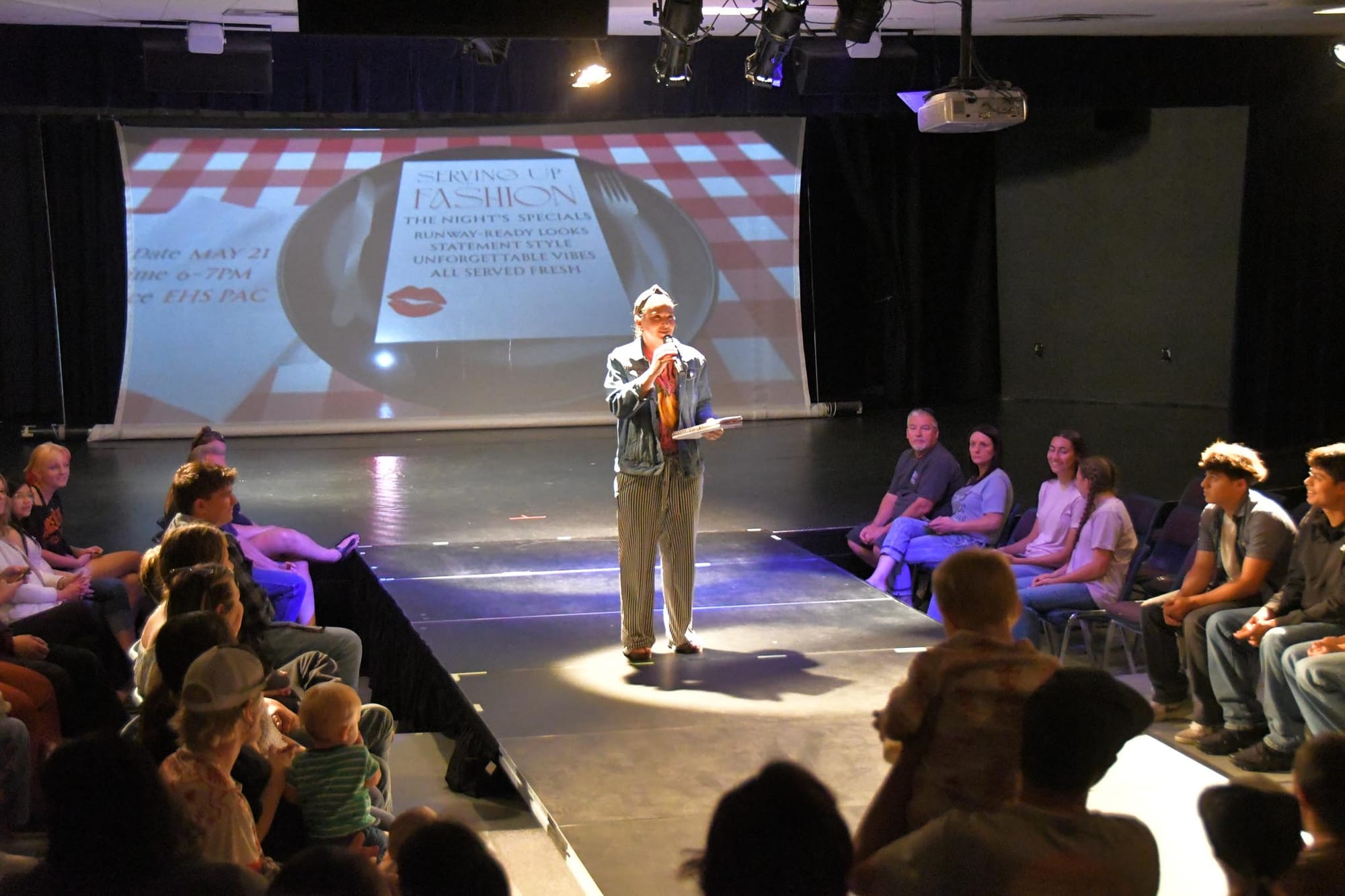 Fabric Arts teacher Carly Morris gets "Serving Up Fashion" underway Thursday night at the EHS Performing Arts Center on the final night of the week-long Multi-Arts Festival.