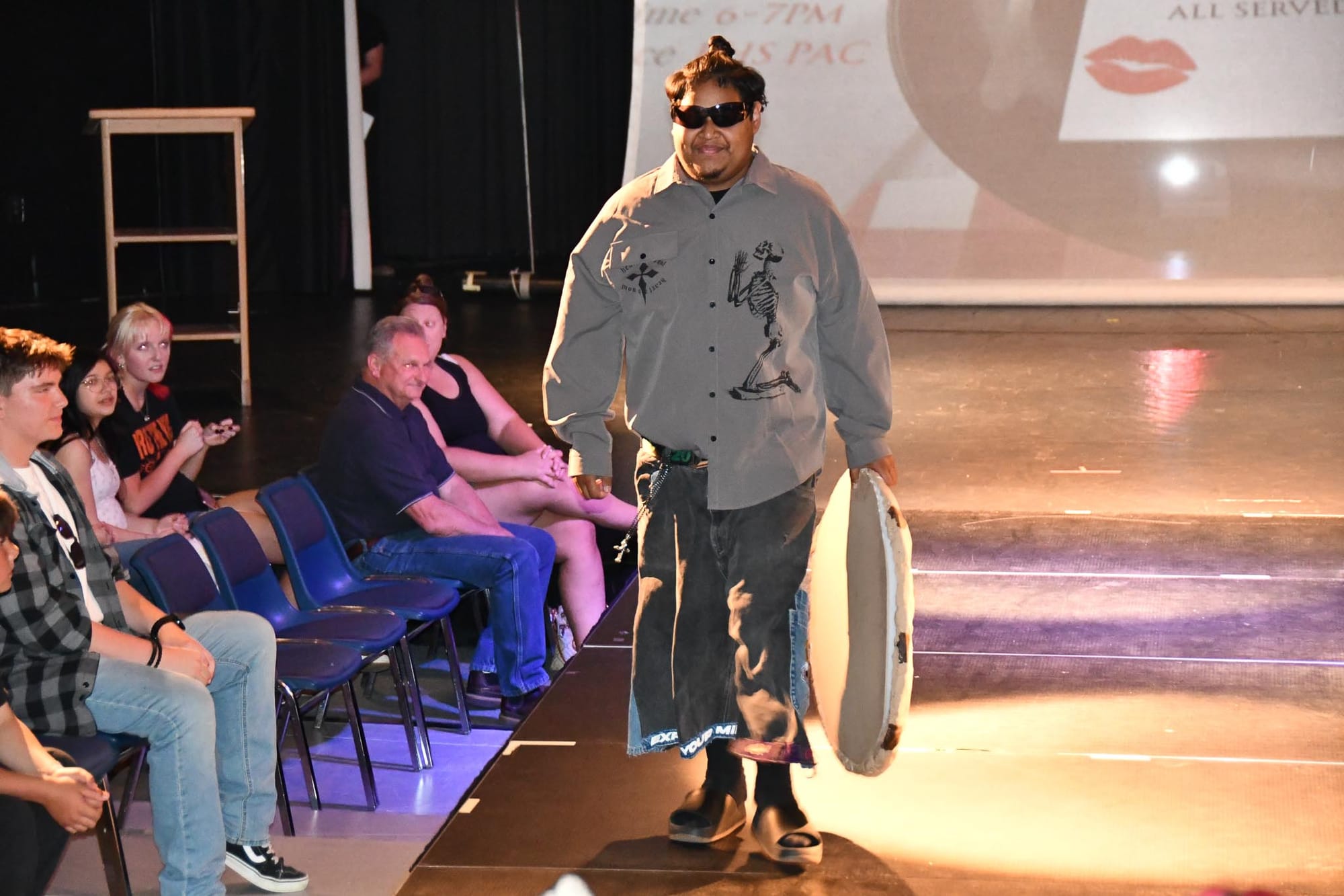 Pablo Simina walks the runway in Raymond Hyce's upcycled denim, the piece that earned the EHS junior the Follow-Through award.