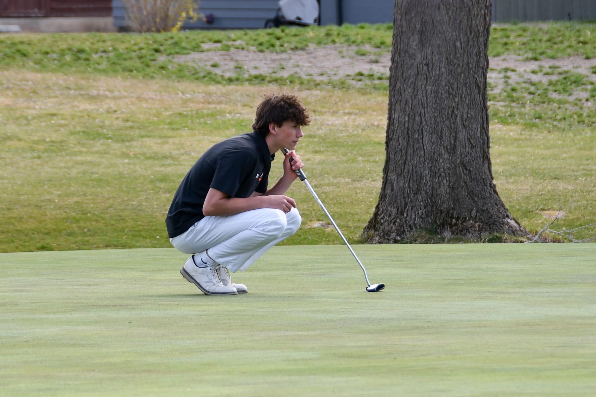 Cody Ogle reads a putt during the Tigers' home CWAC pod match at Lakeview Golf & Country Club on Thursday, March 19. Ogle earned second-team all-conference honors and tied for 39th at the 2A state tournament.