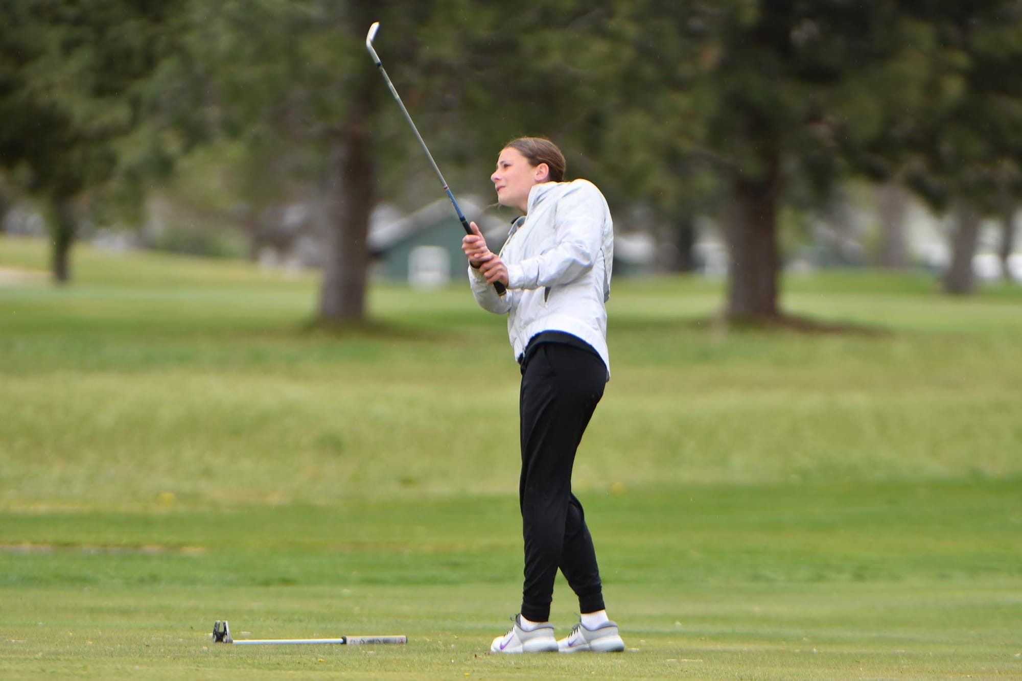 Freshman Sophie Molitor chips onto the green at Lakeview Golf & Country Club during the Tigers' senior night match against Chelan on Tuesday, April 14. Molitor finished her debut season with a second-team all-conference selection and the 2A District 5 individual title.